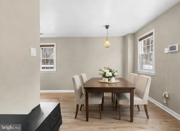 a view of a dining room with furniture and window