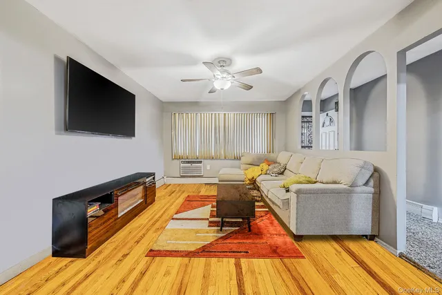 a living room with furniture a table and a chandelier