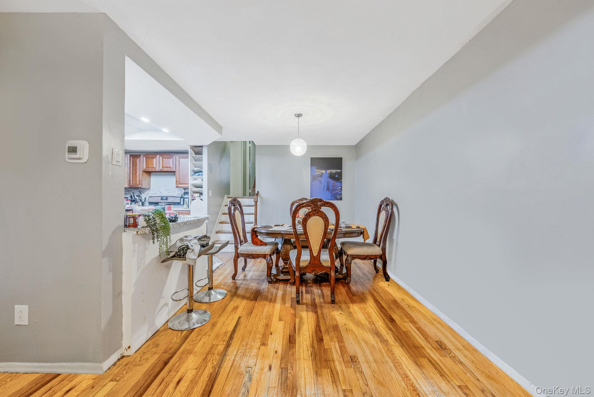 2070 Ralph Avenue Brooklyn, NY 11234 - Photo 18 of 48 a dining room with furniture and wooden floor