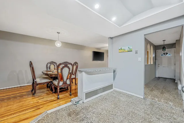 a bedroom with bed and a chandelier