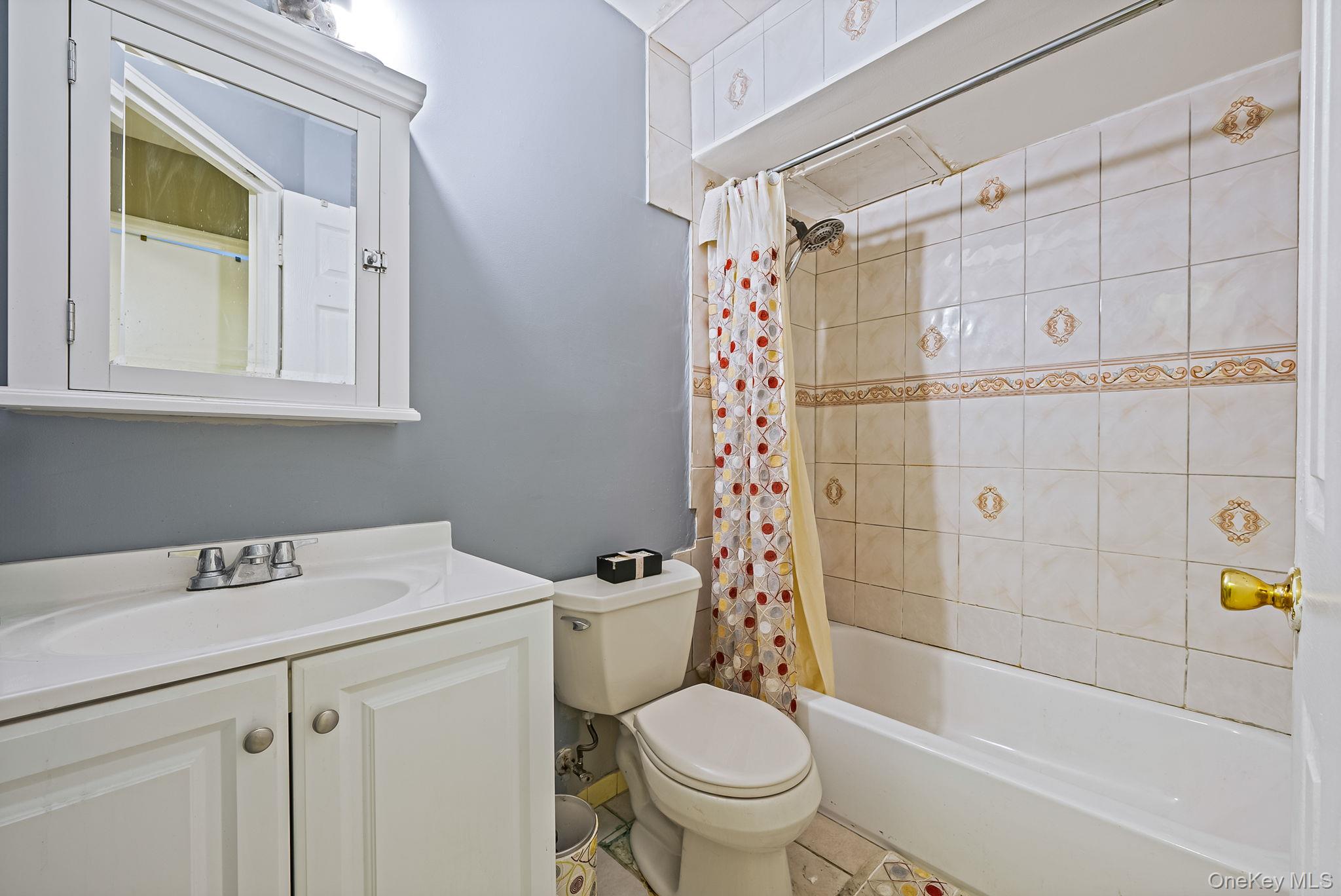 2070 Ralph Avenue Brooklyn, NY 11234 - Photo 34 of 48 a bathroom with a sink toilet and shower