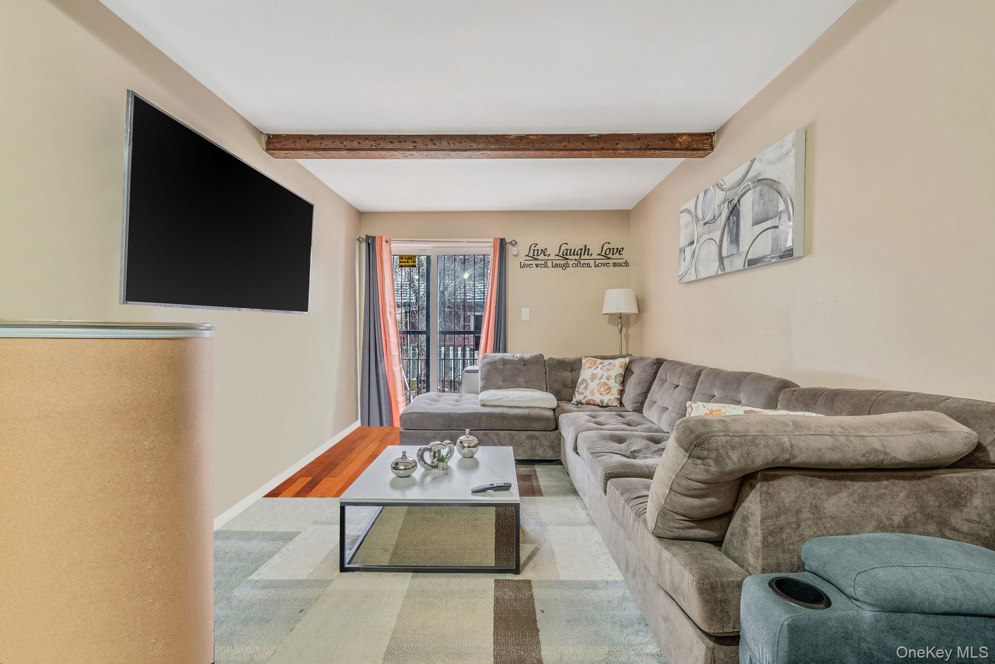 2070 Ralph Avenue Brooklyn, NY 11234 - Photo 39 of 48 a living room with furniture and a flat screen tv