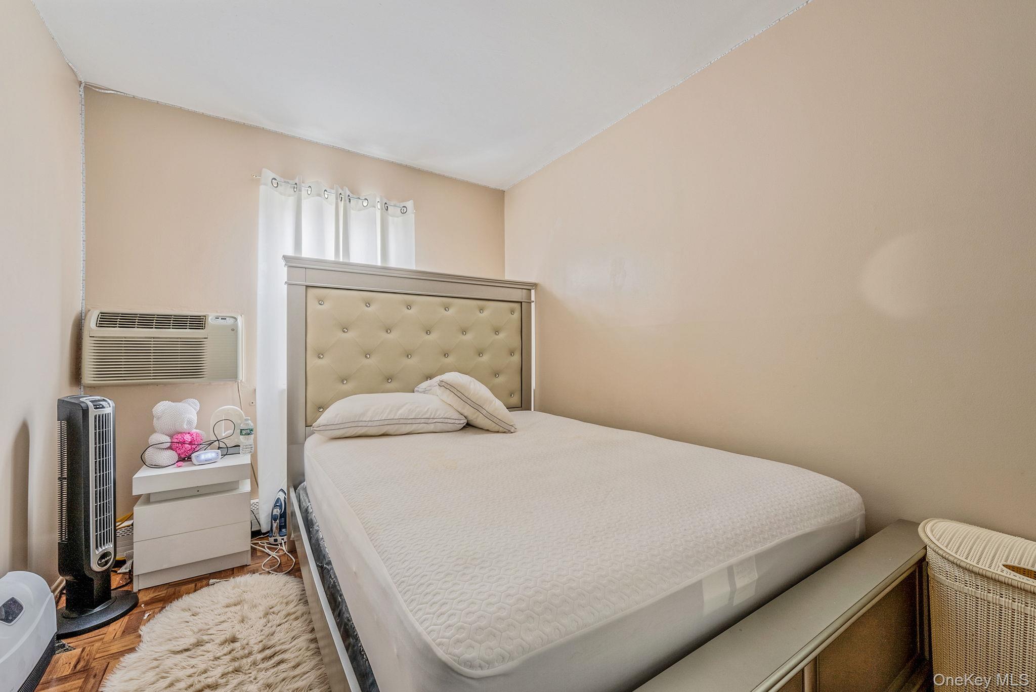2070 Ralph Avenue Brooklyn, NY 11234 - Photo 42 of 48 a bedroom with a bed and a window