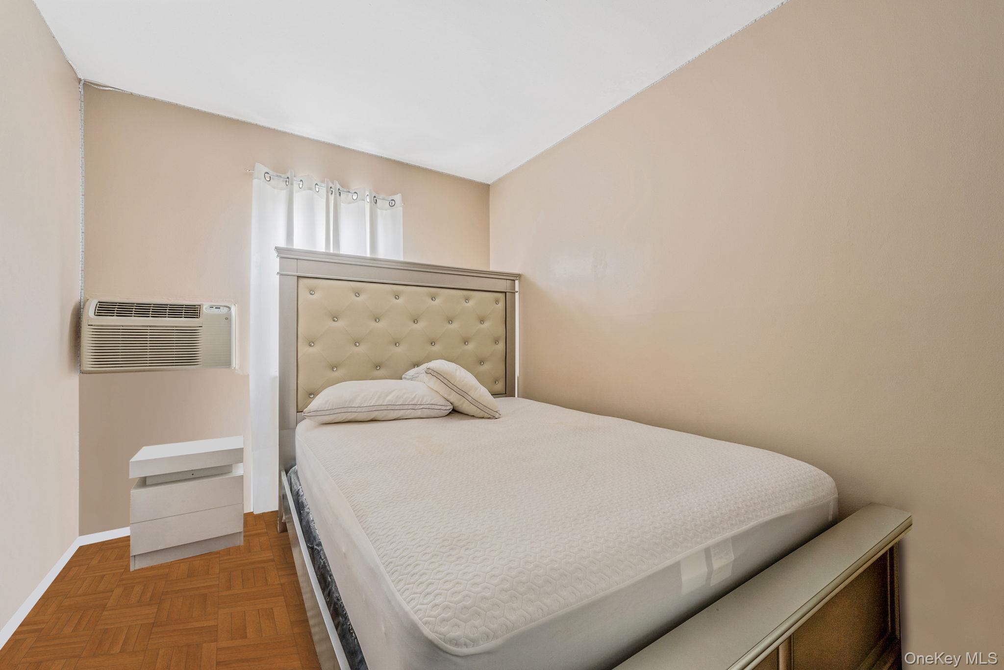 2070 Ralph Avenue Brooklyn, NY 11234 - Photo 43 of 48 a bedroom with a bed and a window