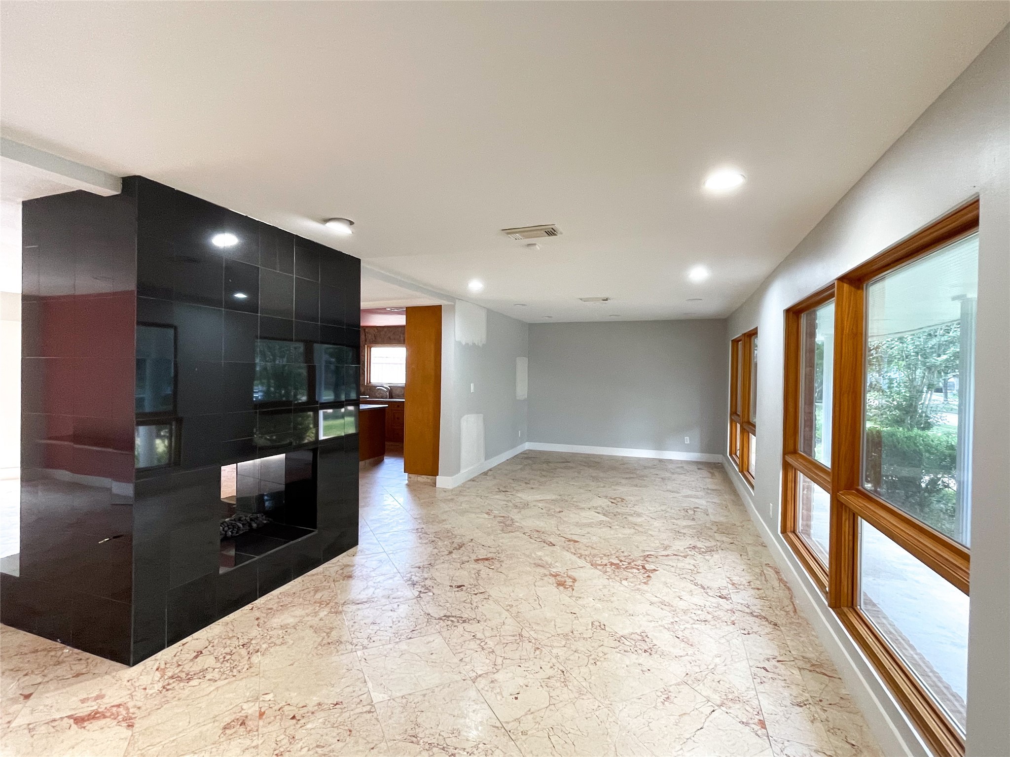 5011 Imogene Street Houston, TX 77096 - Photo 3 of 13 a view of a hallway with wooden floor and staircase