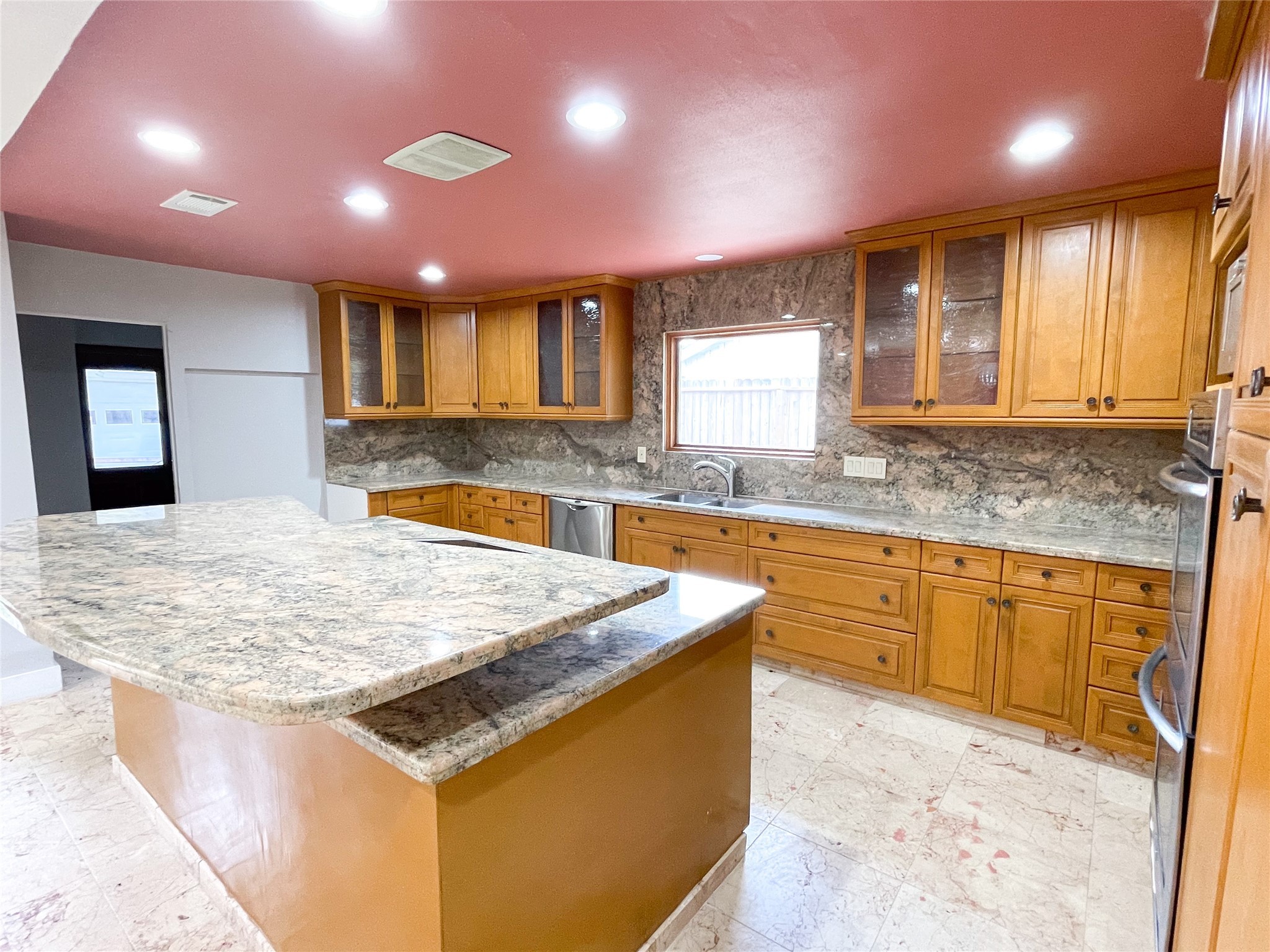 5011 Imogene Street Houston, TX 77096 - Photo 5 of 13 a kitchen with stainless steel appliances granite countertop wooden cabinets a sink and a granite counter tops