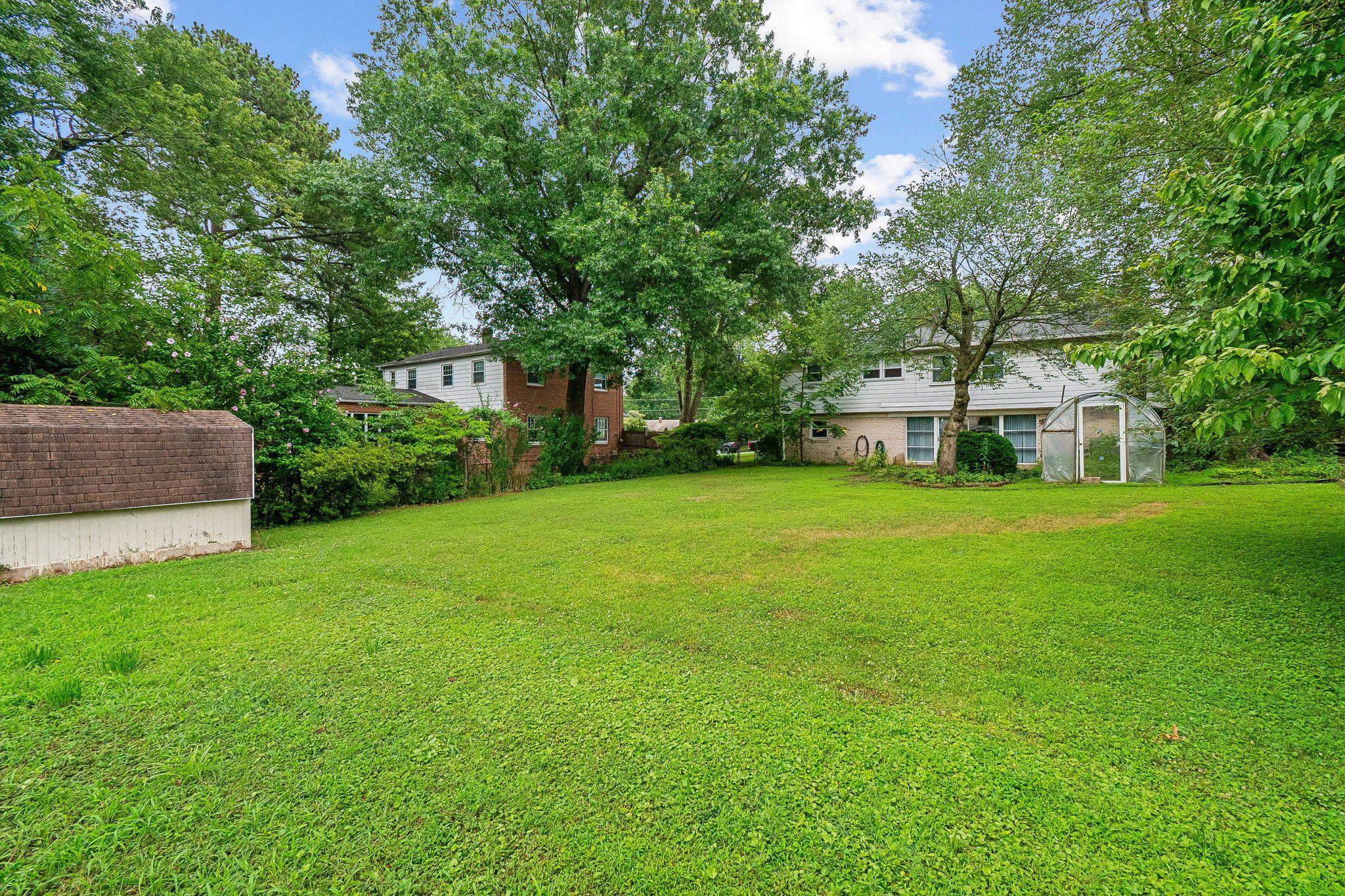 2807 Hathaway Terrace Silver Spring, MD 20906 - Photo 19 of 20 a view of a house with a big yard and large trees