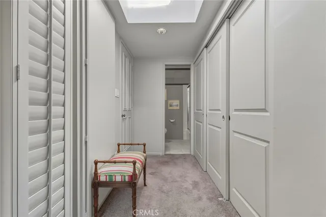 a room with a chair and the entryway