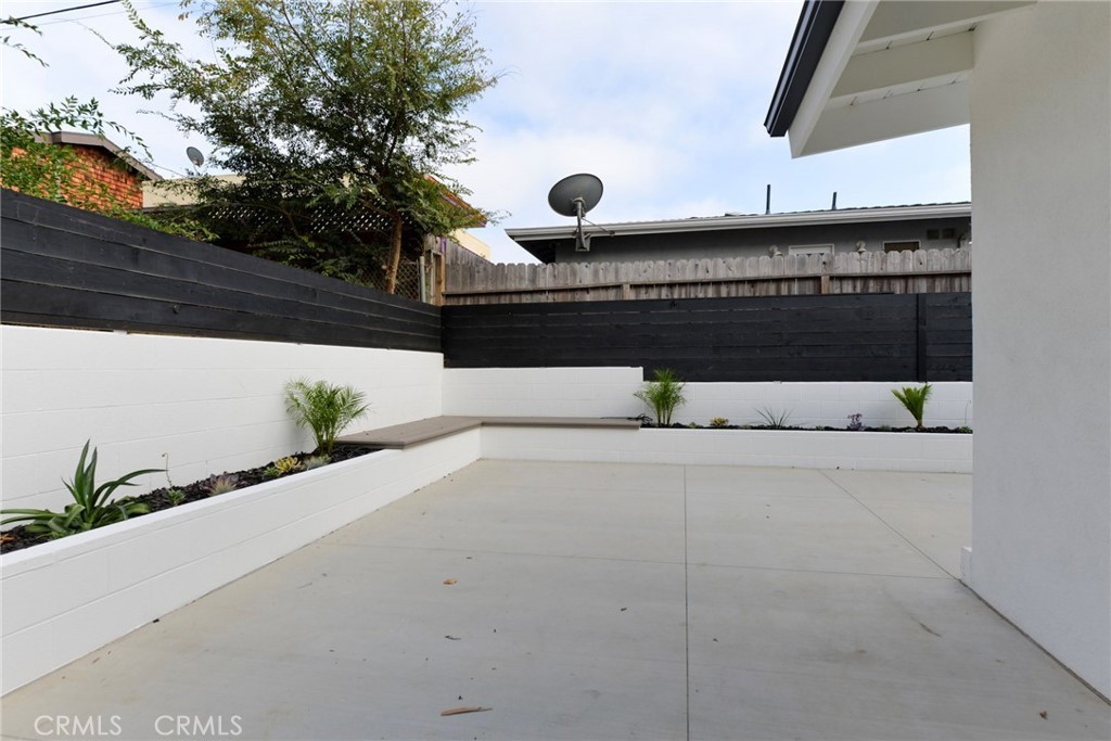 223 Avenida De La Grulla, Unit B San Clemente, CA 92672 - Photo 11 of 11 a view of a bench in front of a building