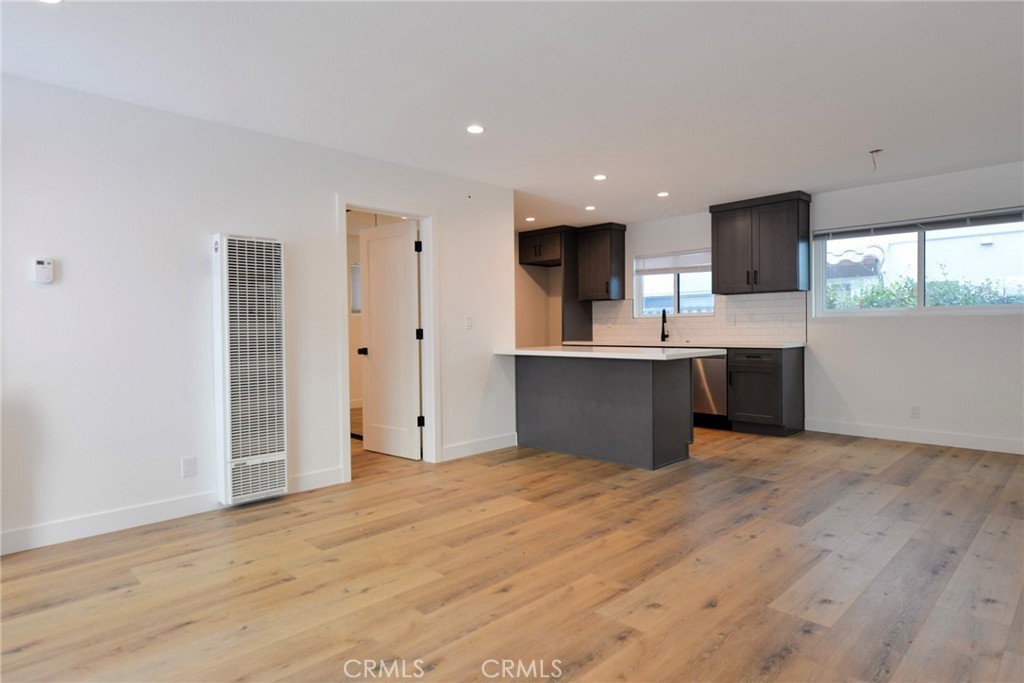 223 Avenida De La Grulla, Unit B San Clemente, CA 92672 - Photo 3 of 11 a view of kitchen with wooden floor and electronic appliances