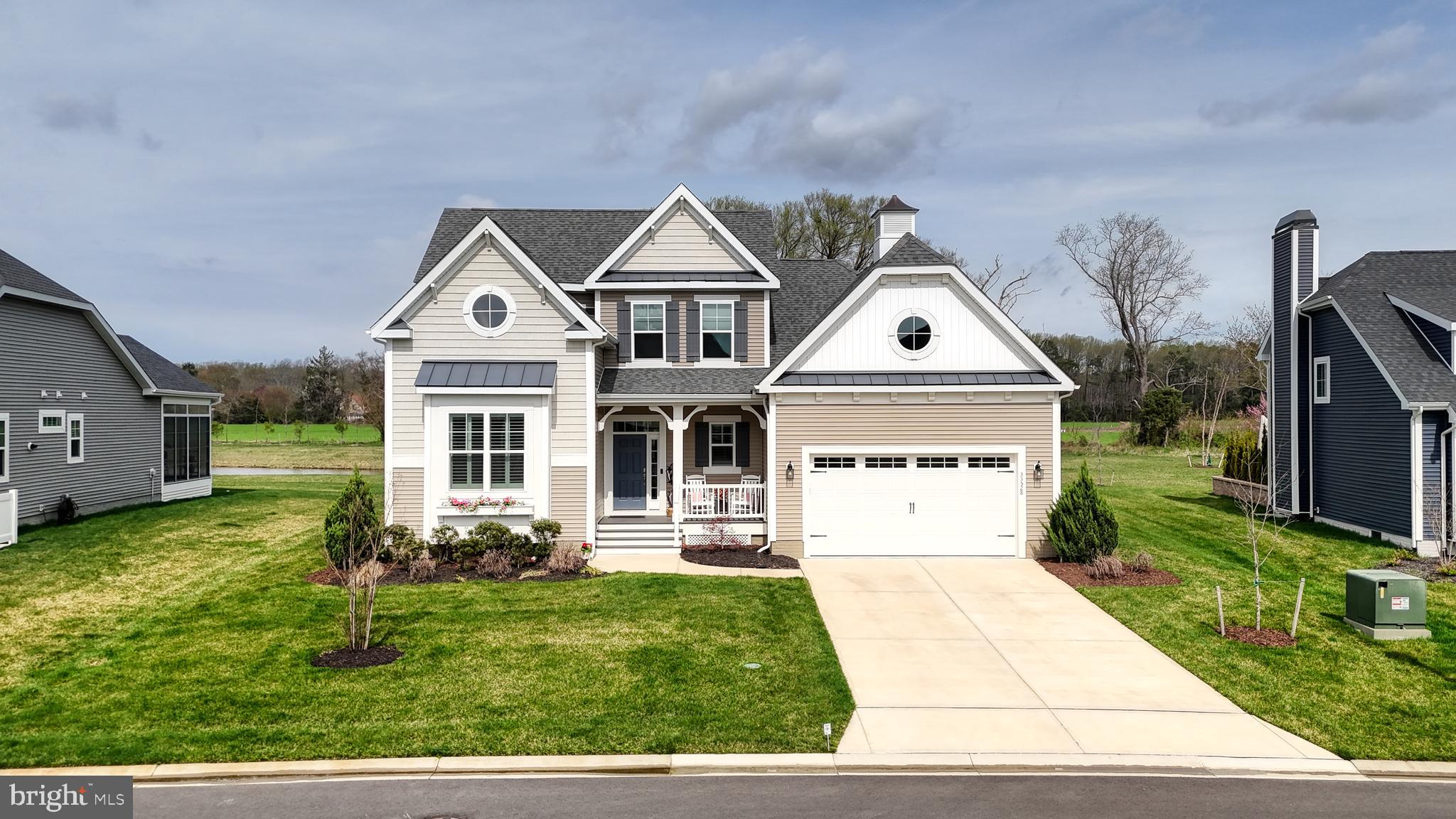 33528 Downing Circle Lewes, DE 19958 - Photo 2 of 72 a front view of a house with a yard