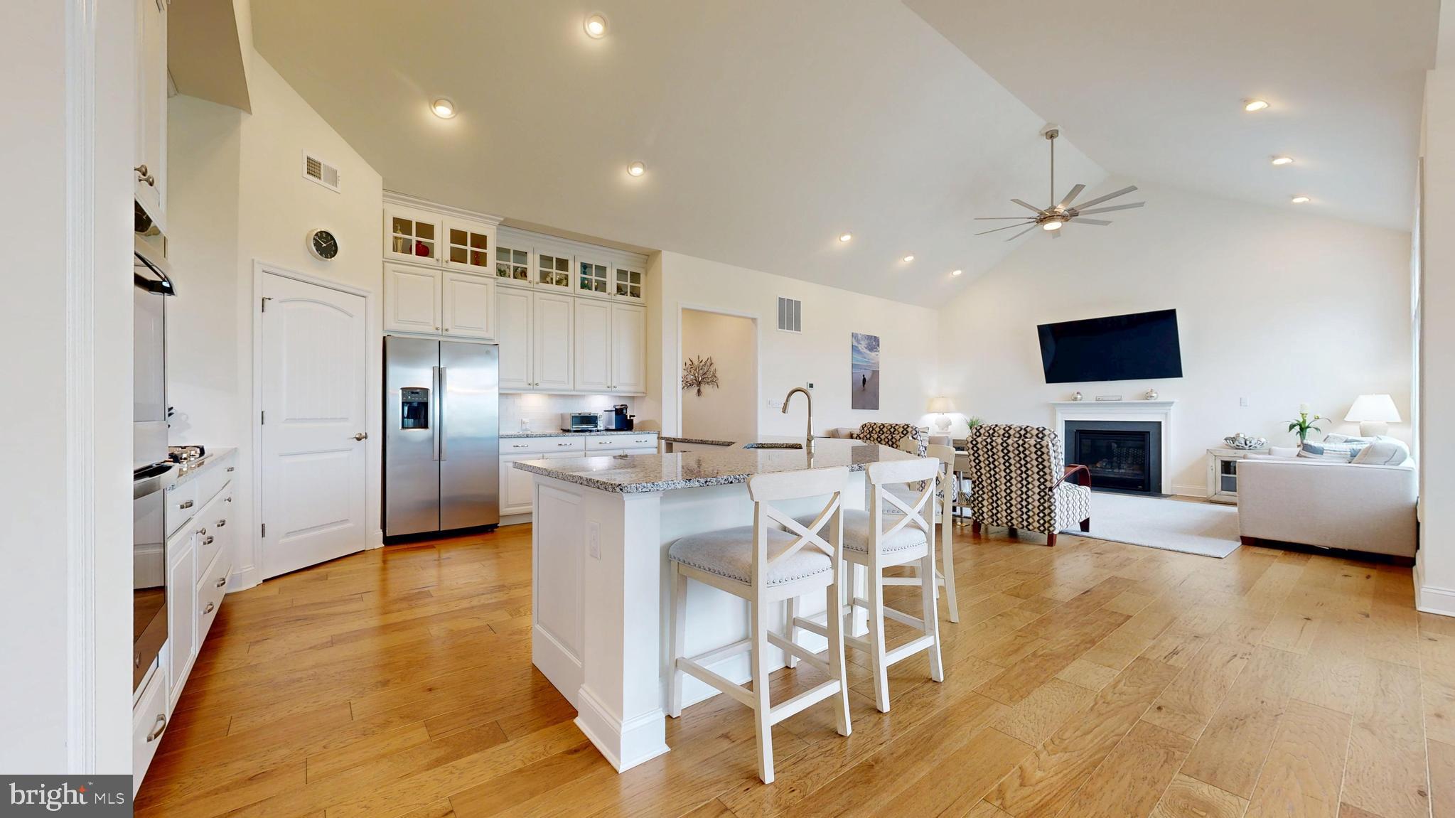 33528 Downing Circle Lewes, DE 19958 - Photo 21 of 72 a view of a dining room kitchen with furniture and a fireplace