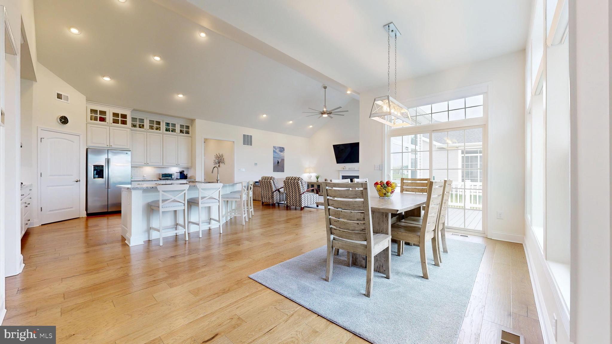 33528 Downing Circle Lewes, DE 19958 - Photo 24 of 72 a view of a dining room with furniture window and wooden floor
