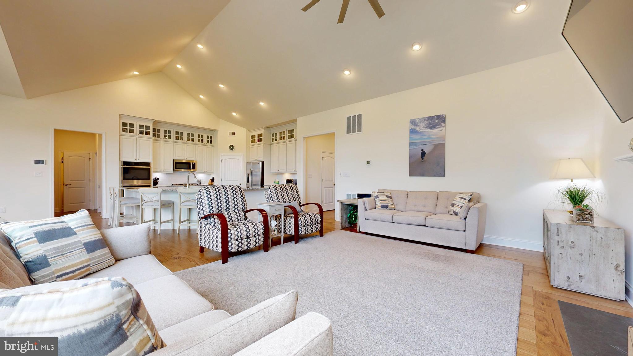 33528 Downing Circle Lewes, DE 19958 - Photo 25 of 72 a living room with furniture and kitchen view