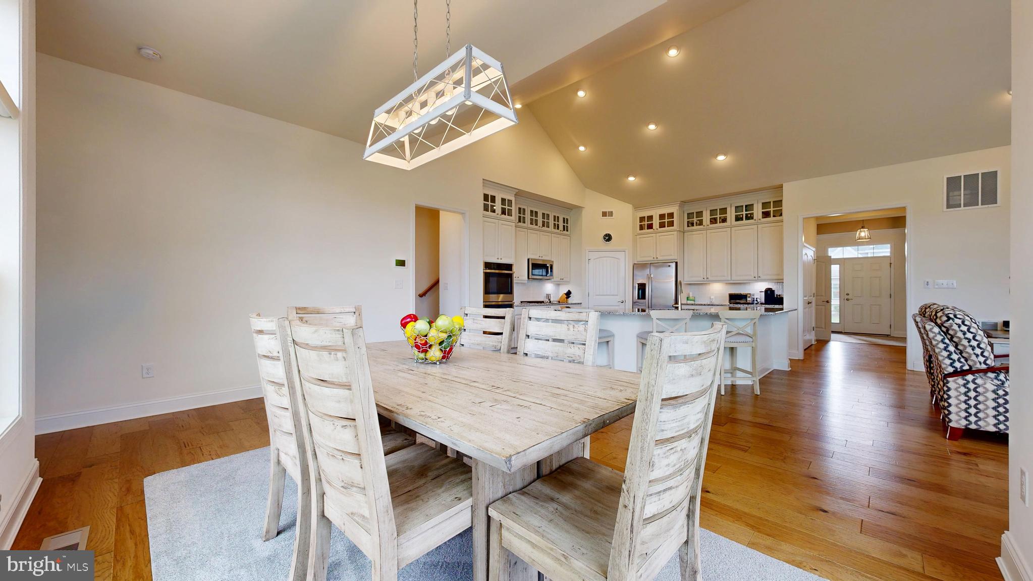 33528 Downing Circle Lewes, DE 19958 - Photo 27 of 72 a view of kitchen and dining area with chandelier