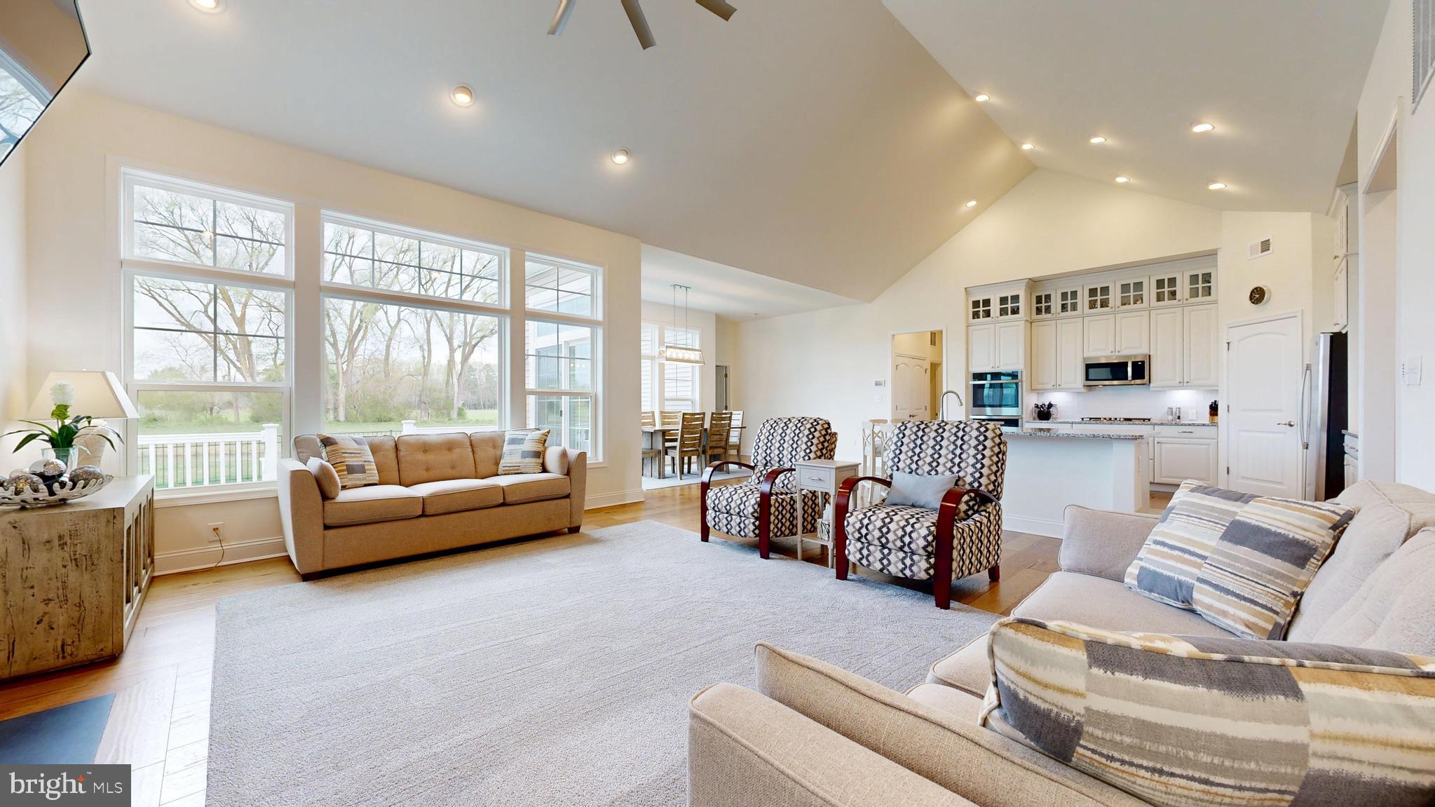 33528 Downing Circle Lewes, DE 19958 - Photo 30 of 72 a living room with furniture and a large window