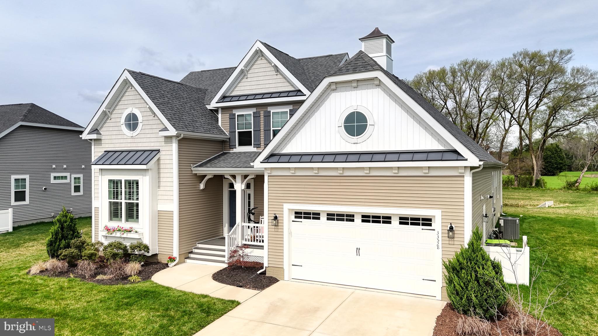 33528 Downing Circle Lewes, DE 19958 - Photo 3 of 72 a view of a house with a yard