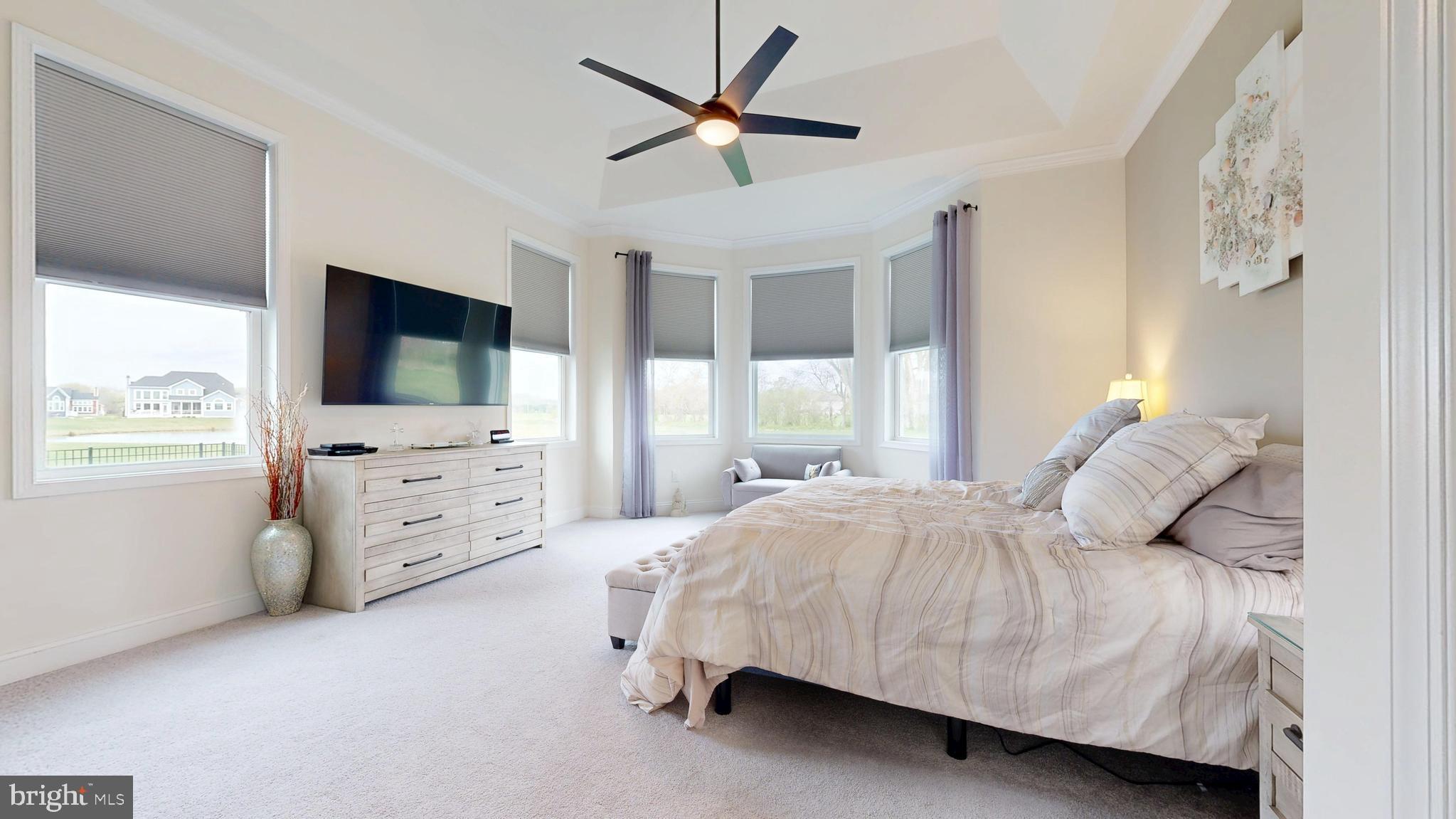 33528 Downing Circle Lewes, DE 19958 - Photo 31 of 72 a bedroom with a bed and a flat screen tv