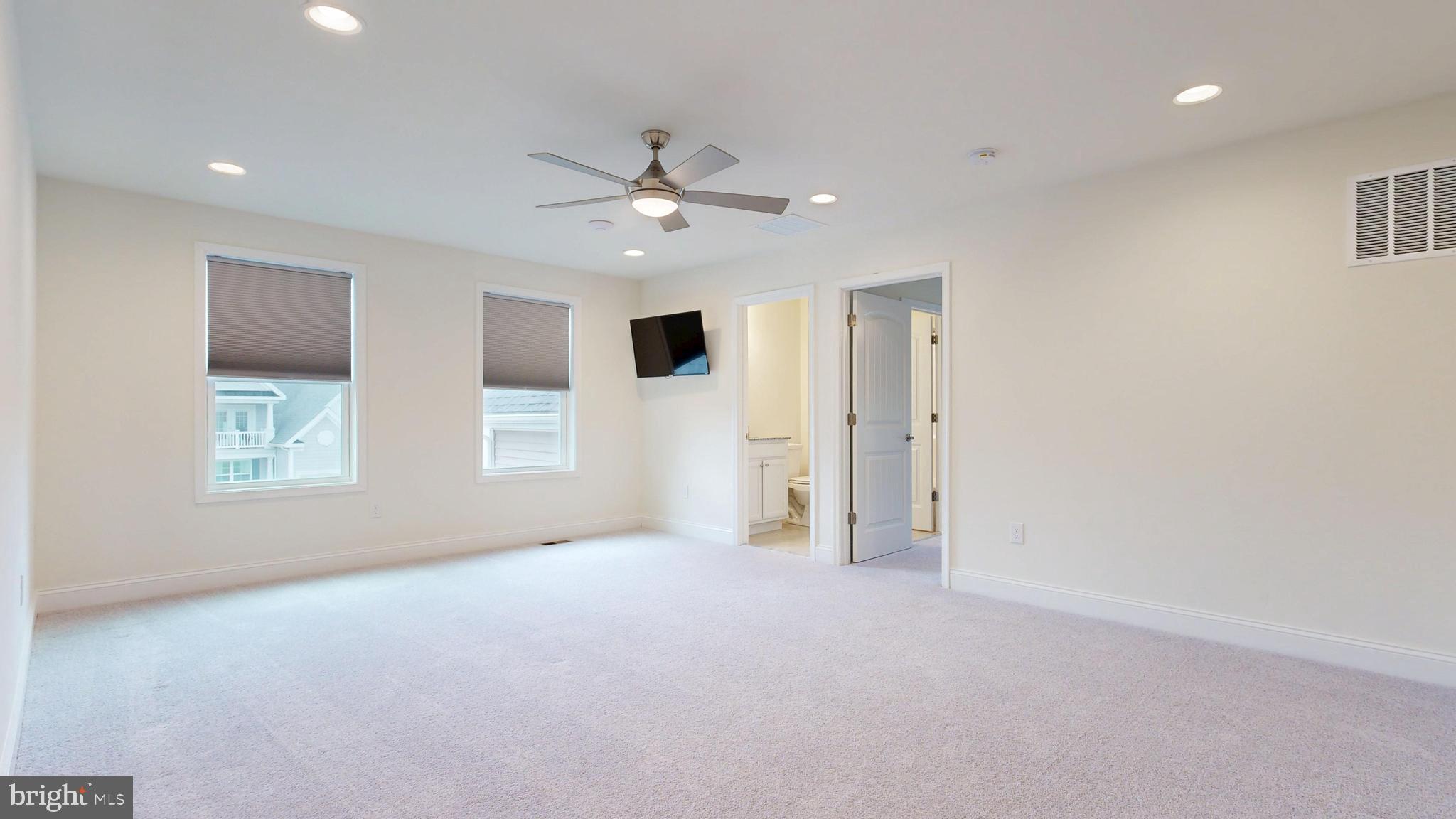 33528 Downing Circle Lewes, DE 19958 - Photo 43 of 72 an empty room with windows and fan