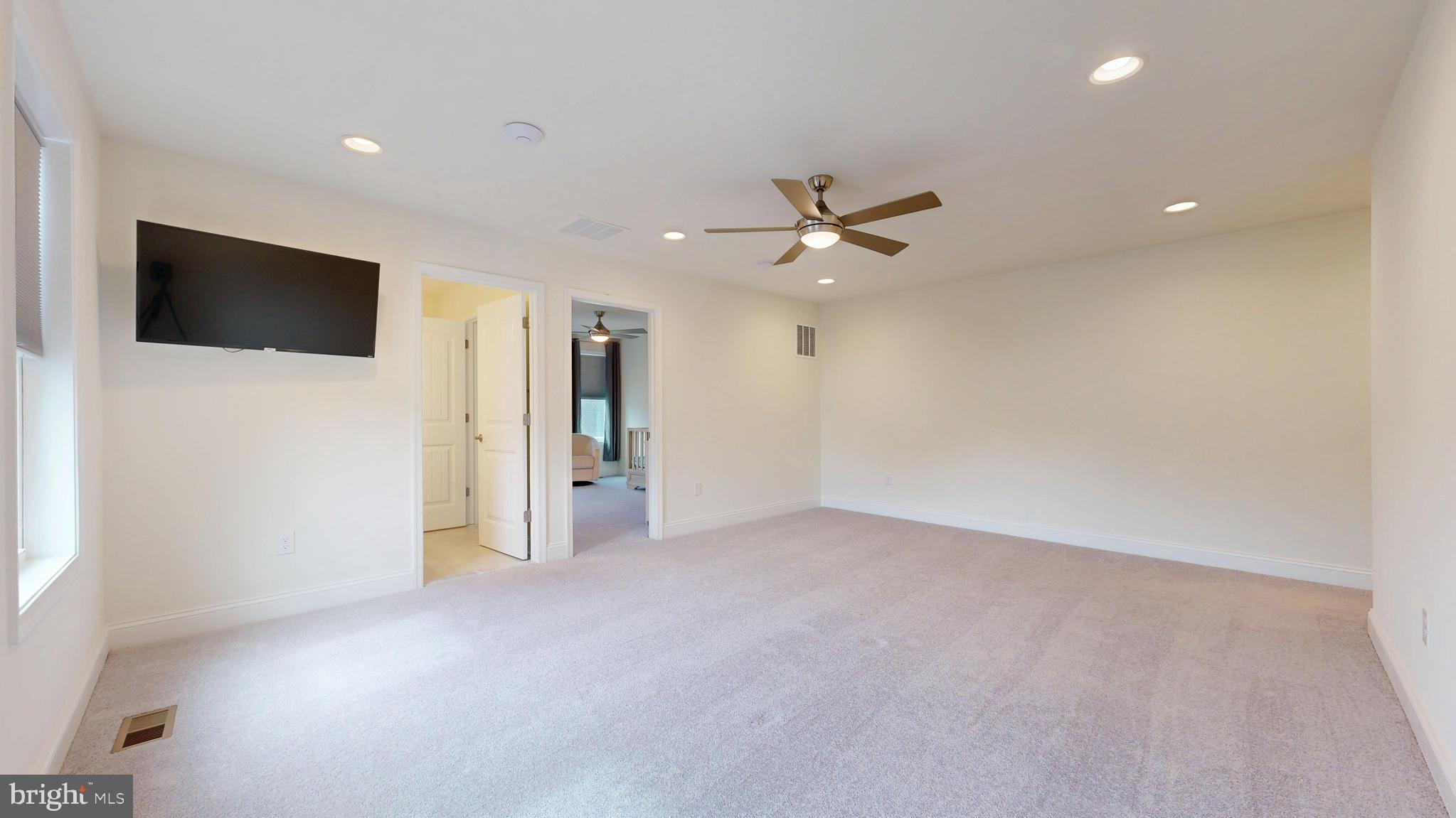 33528 Downing Circle Lewes, DE 19958 - Photo 44 of 72 a view of a livingroom with a flat screen tv