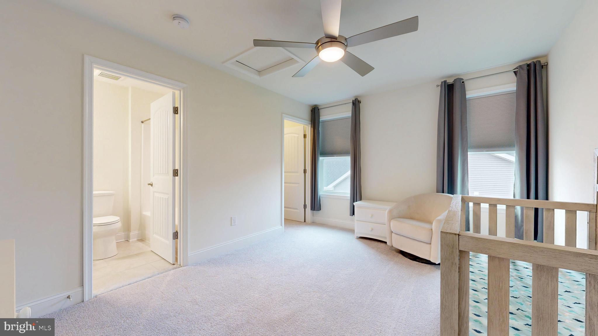 33528 Downing Circle Lewes, DE 19958 - Photo 46 of 72 a view of a bedroom with furniture and a ceiling fan