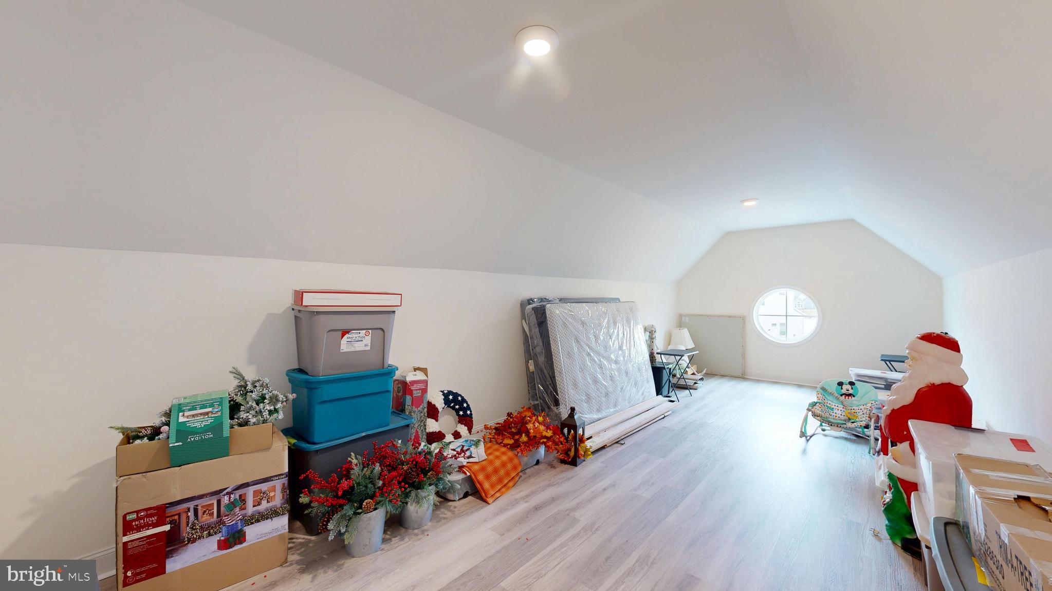 33528 Downing Circle Lewes, DE 19958 - Photo 51 of 72 a bedroom with furniture and a wooden floor