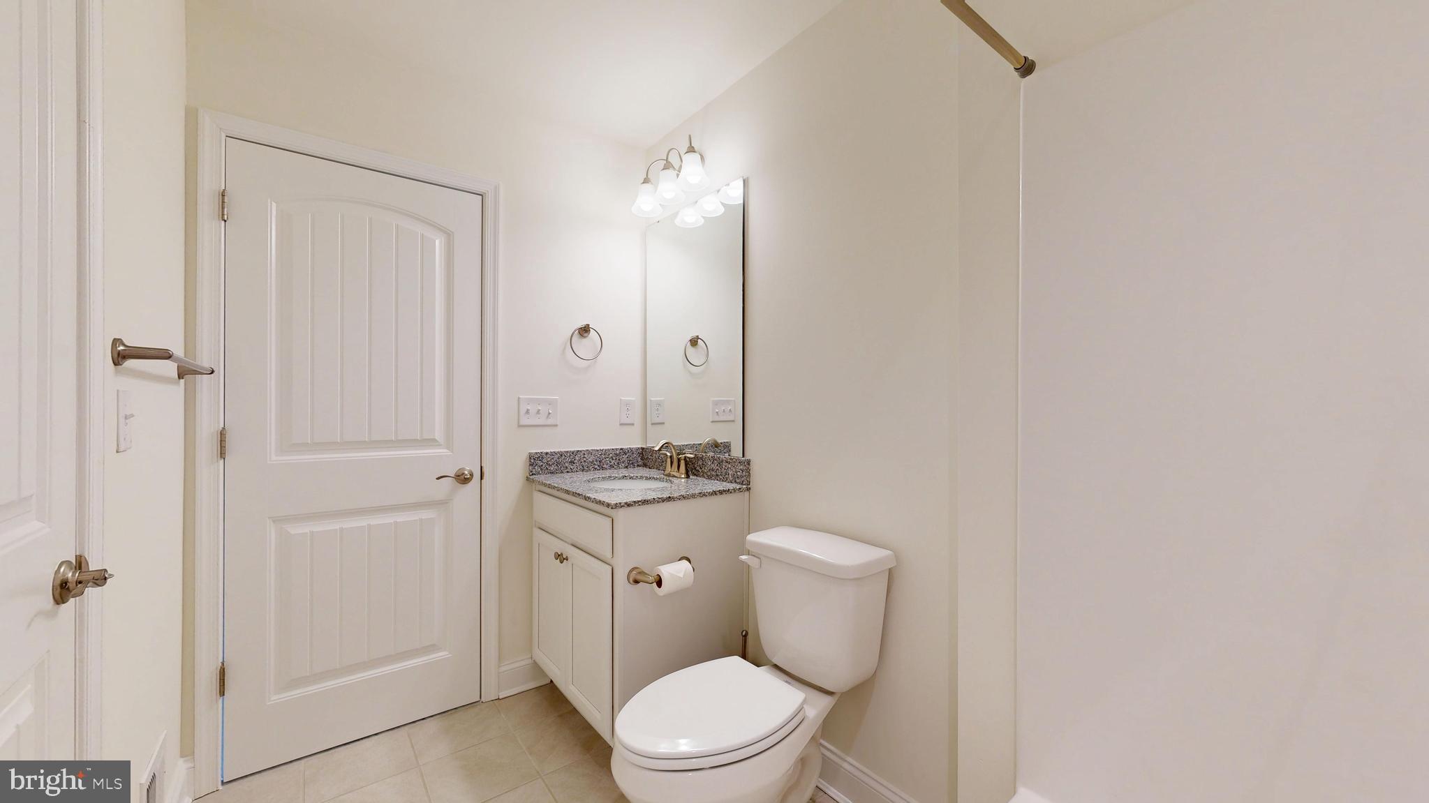 33528 Downing Circle Lewes, DE 19958 - Photo 56 of 72 a bathroom with a toilet a sink and shower