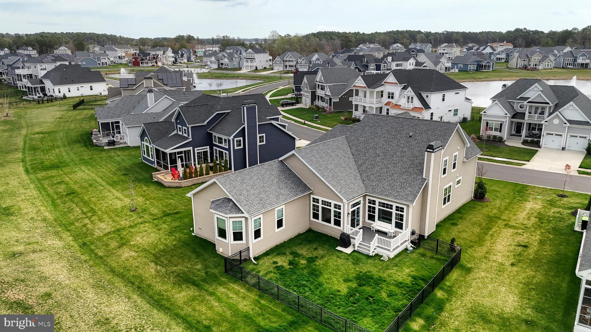33528 Downing Circle Lewes, DE 19958 - Photo 6 of 72 an aerial view of residential houses with outdoor space and river