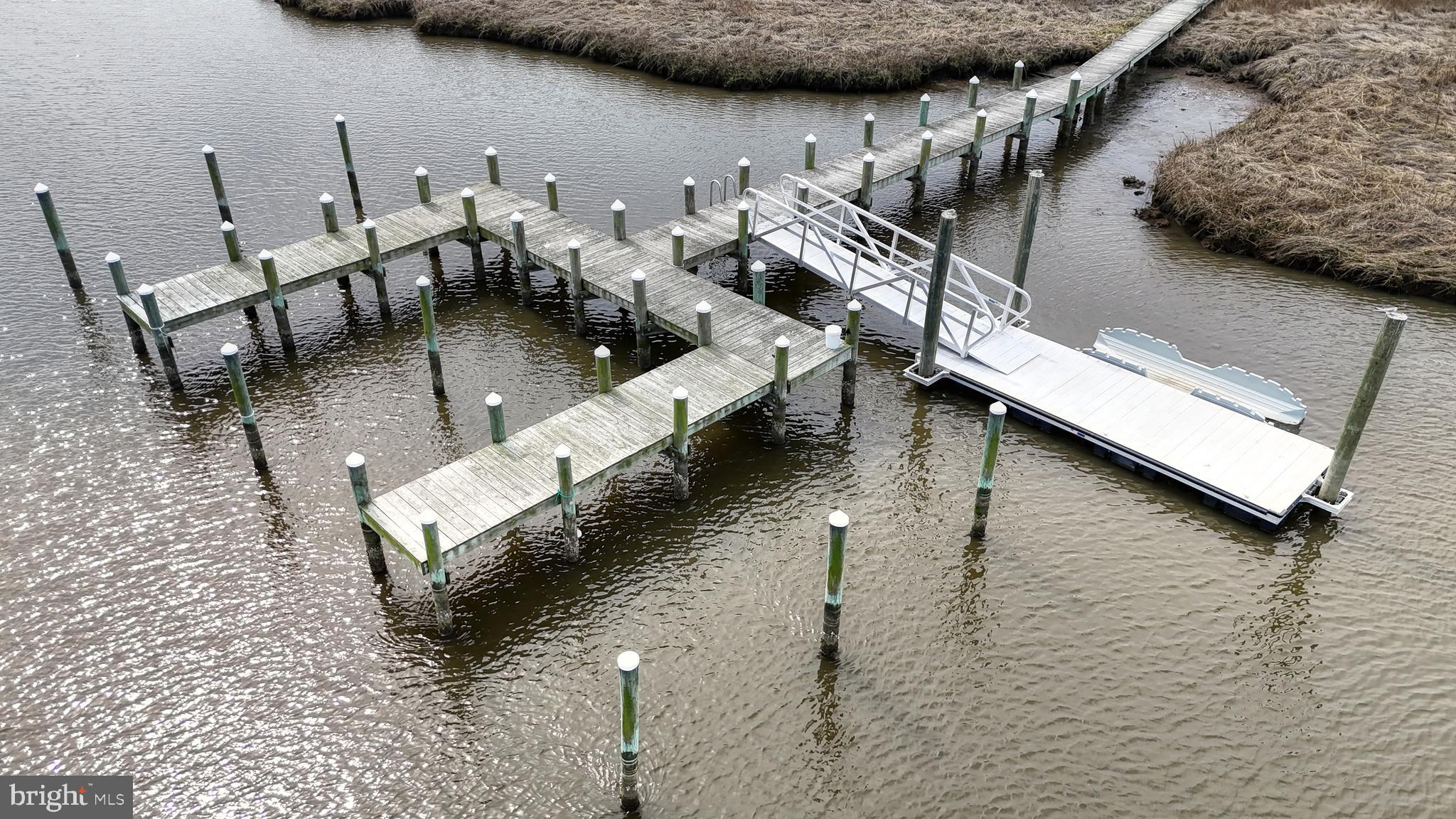 33528 Downing Circle Lewes, DE 19958 - Photo 68 of 72 a terrace with outdoor seating and trees