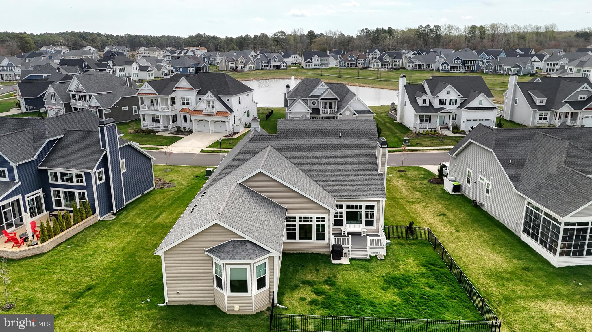 33528 Downing Circle Lewes, DE 19958 - Photo 7 of 72 an aerial view of a house with outdoor space and a lake view