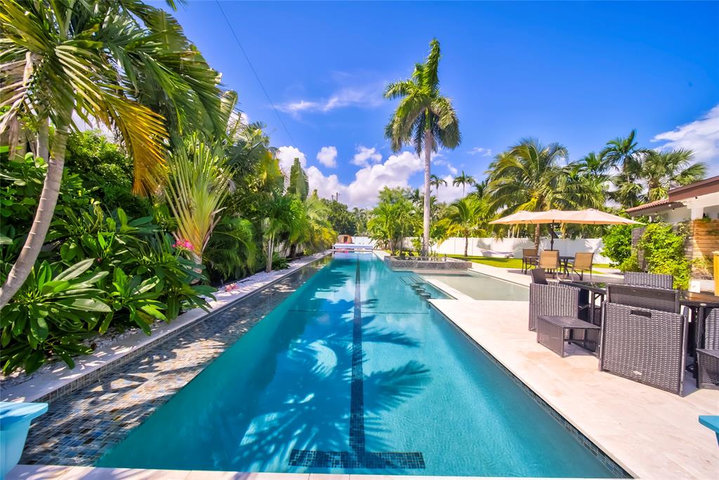 a view of a swimming pool with a patio
