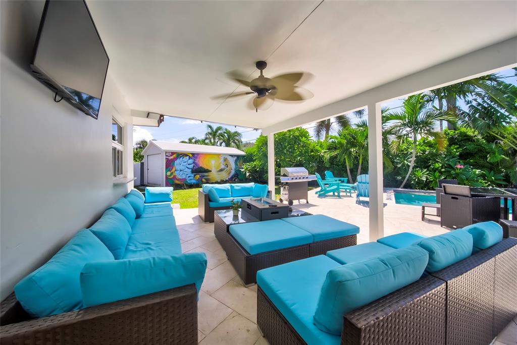 250 Northeast 27th Court Boca Raton, FL 33431 - Photo 13 of 29 a living room with furniture and a floor to ceiling window