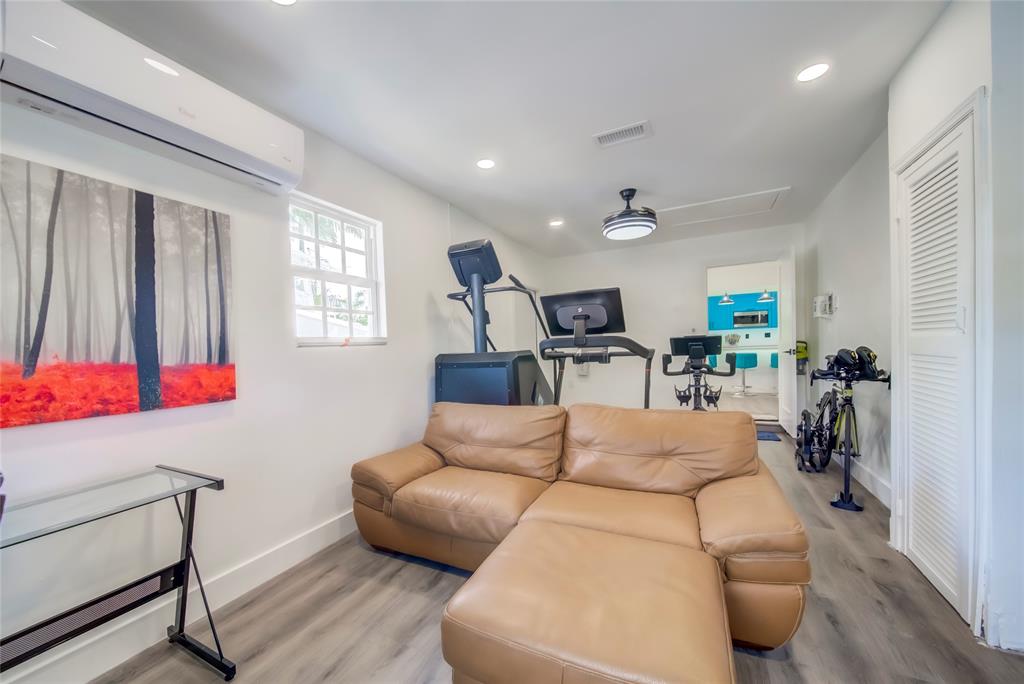 250 Northeast 27th Court Boca Raton, FL 33431 - Photo 17 of 29 a living room with furniture and a window