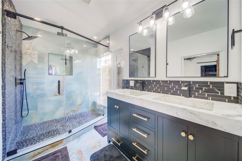 250 Northeast 27th Court Boca Raton, FL 33431 - Photo 20 of 29 a bathroom with a granite countertop sink mirror and double