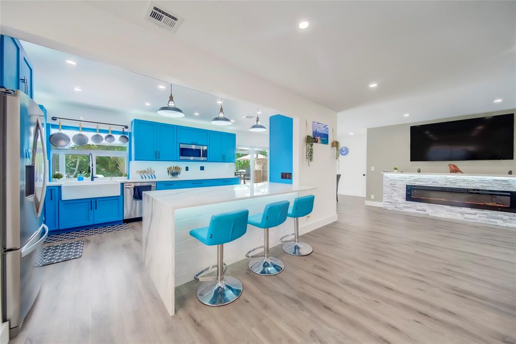 250 Northeast 27th Court Boca Raton, FL 33431 - Photo 22 of 29 a living room with furniture and a flat screen tv