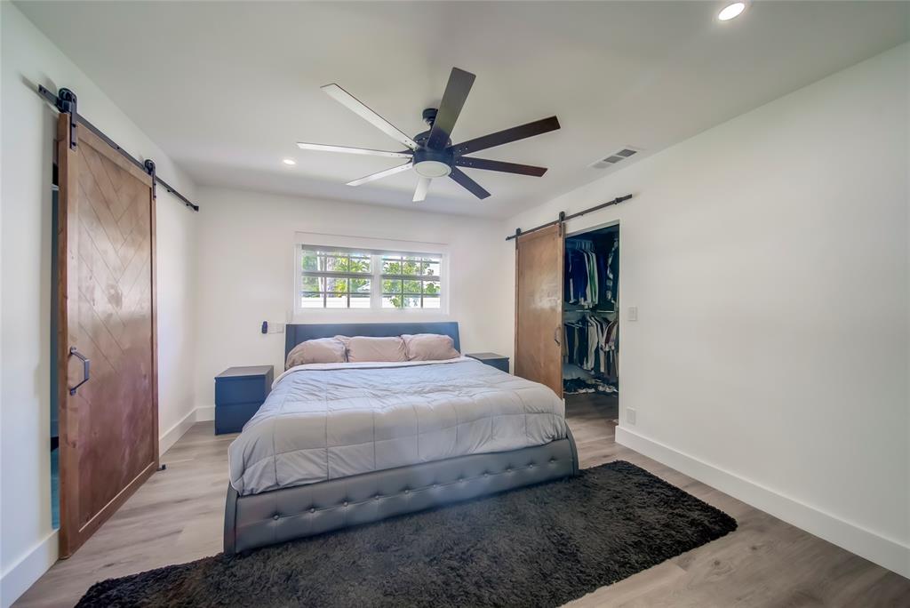 250 Northeast 27th Court Boca Raton, FL 33431 - Photo 24 of 29 a bedroom with a bed and a window