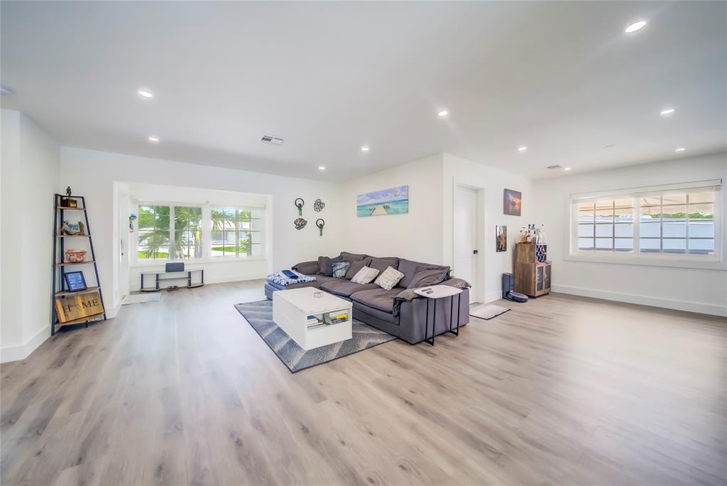250 Northeast 27th Court Boca Raton, FL 33431 - Photo 27 of 29 a living room with furniture and a window