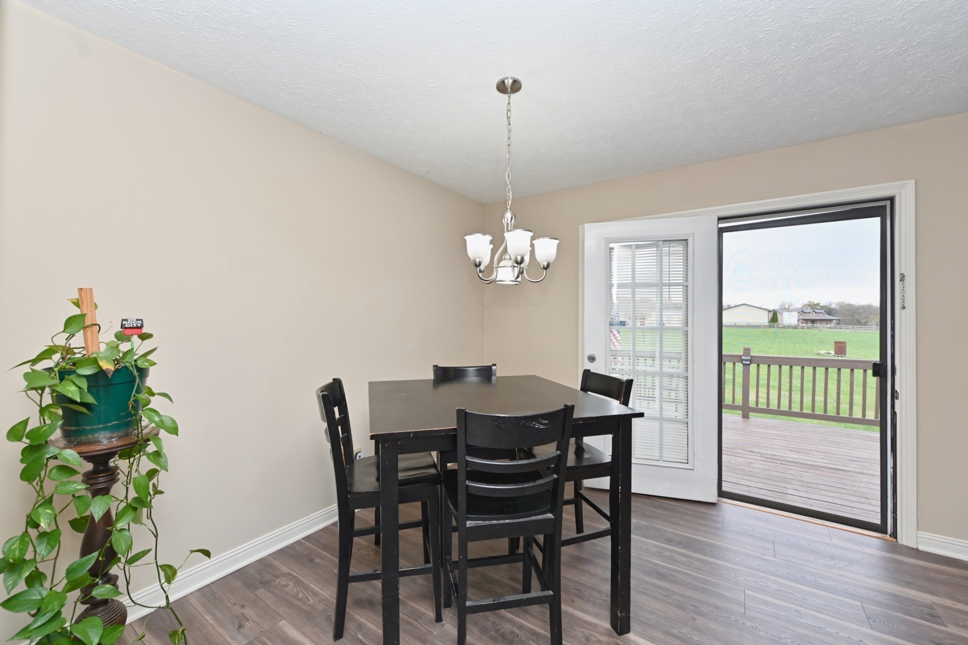 134 T G T Road Portland, TN 37148 - Photo 12 of 27 a view of a dining room with furniture window and wooden floor