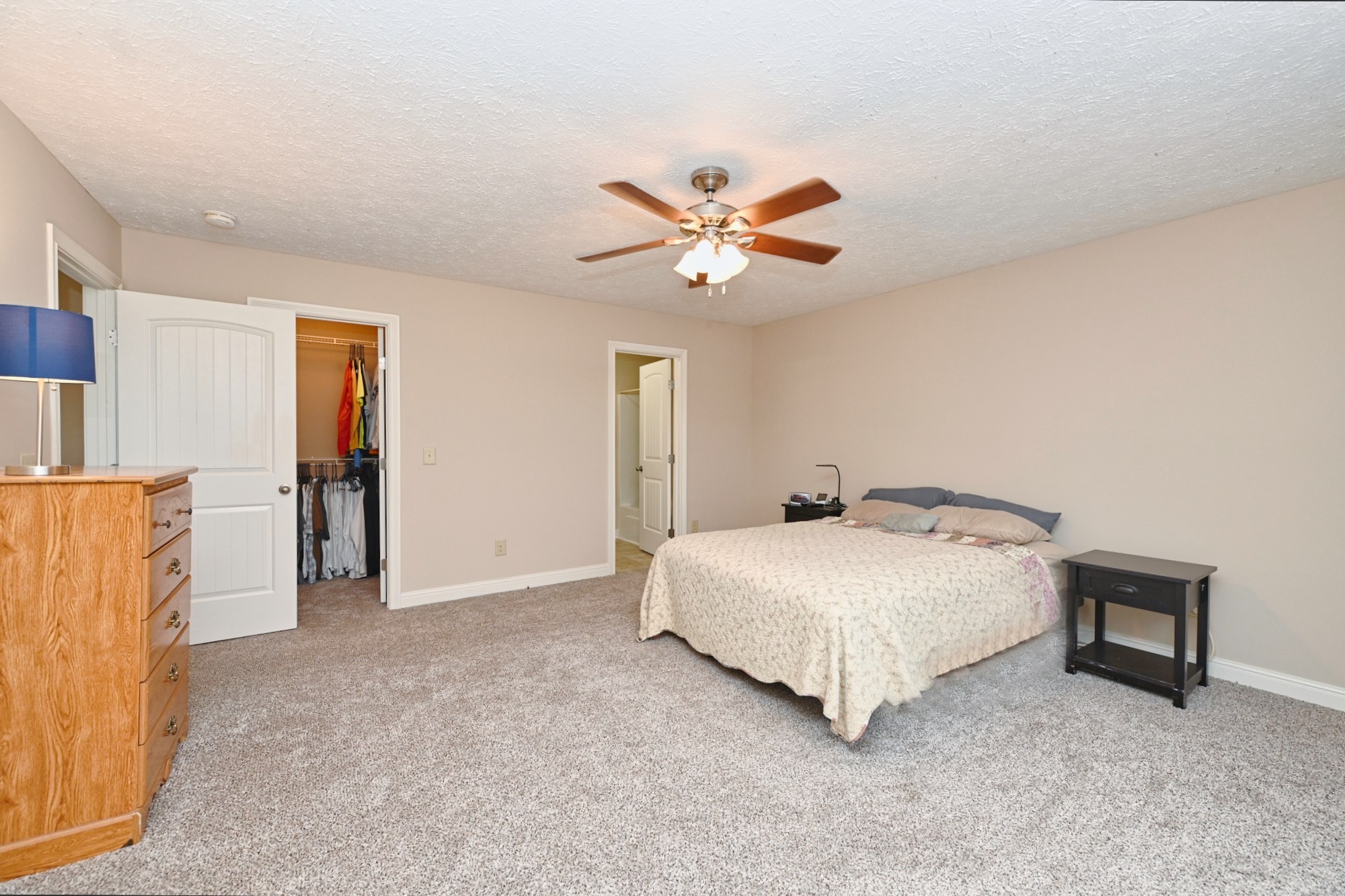 134 T G T Road Portland, TN 37148 - Photo 15 of 27 a bedroom with a bed and a chandelier
