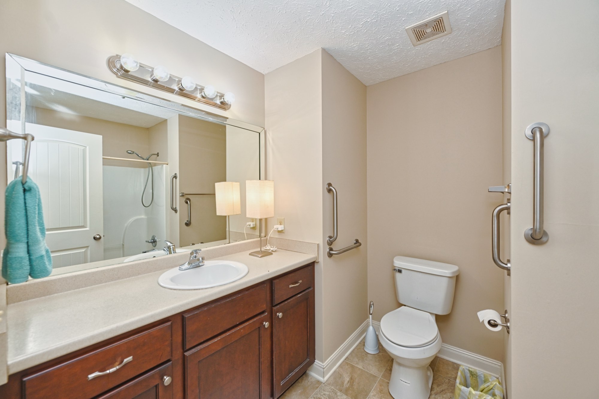 134 T G T Road Portland, TN 37148 - Photo 16 of 27 a bathroom with a double vanity sink toilet and mirror