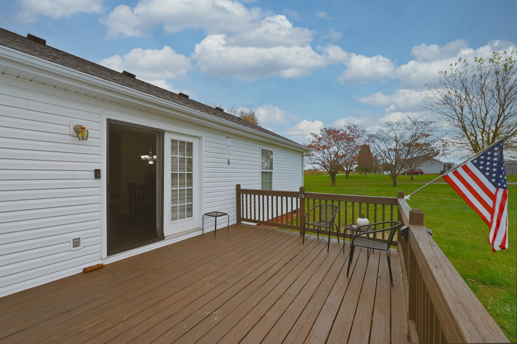 134 T G T Road Portland, TN 37148 - Photo 4 of 27 a balcony with wooden floor table and chairs