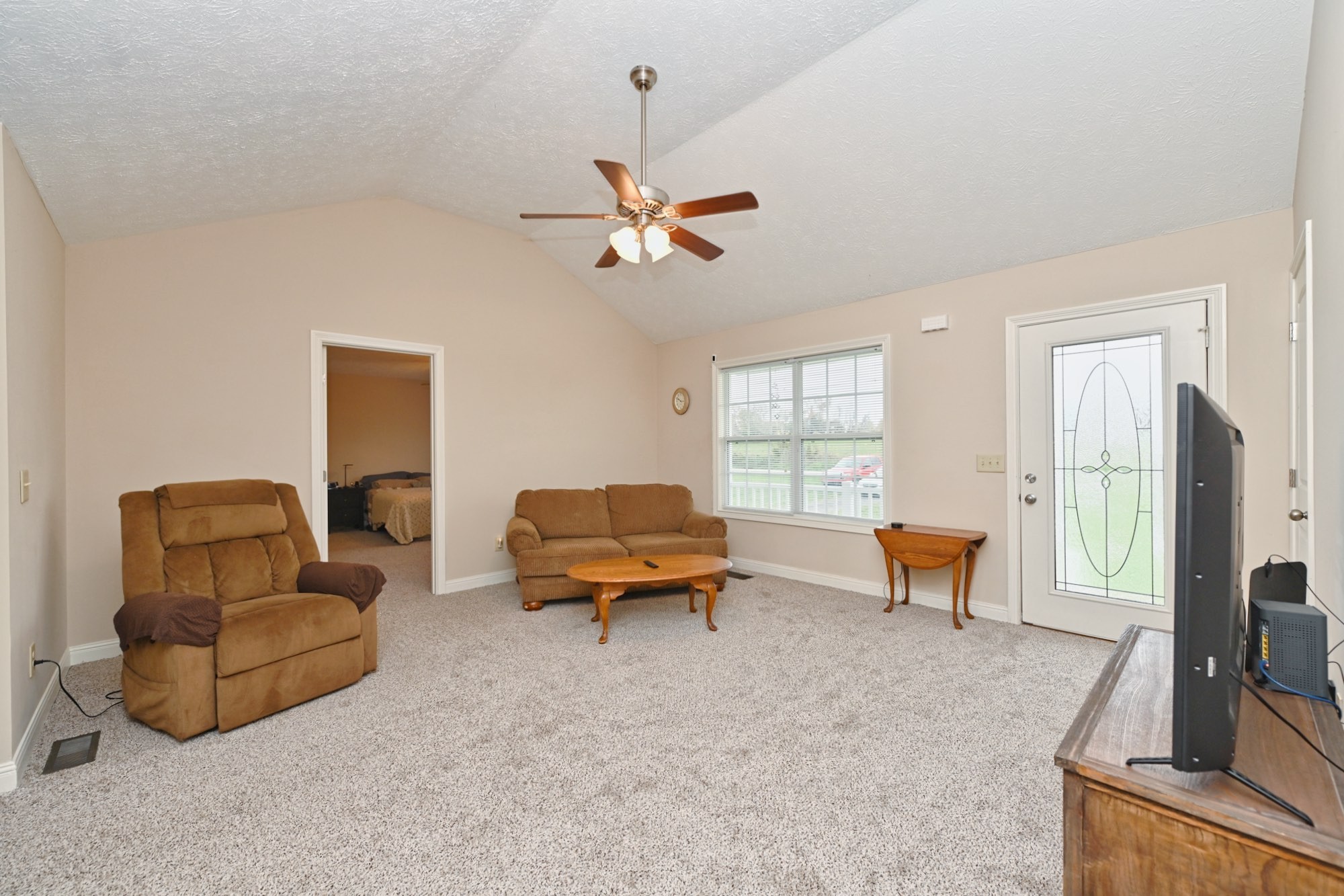 134 T G T Road Portland, TN 37148 - Photo 5 of 27 a living room with furniture a table and a flat screen tv