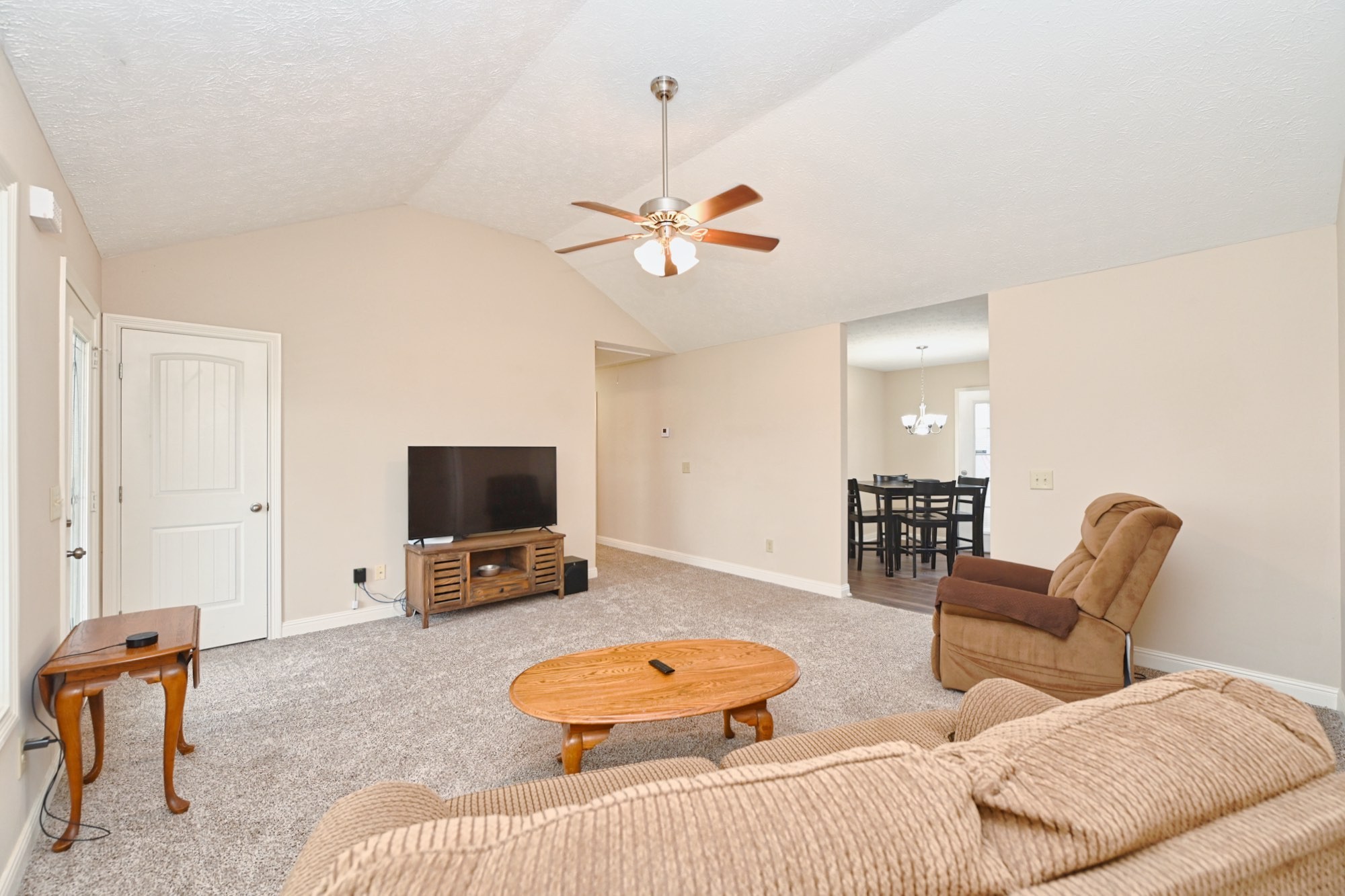 134 T G T Road Portland, TN 37148 - Photo 7 of 27 a bedroom with furniture and a chandelier