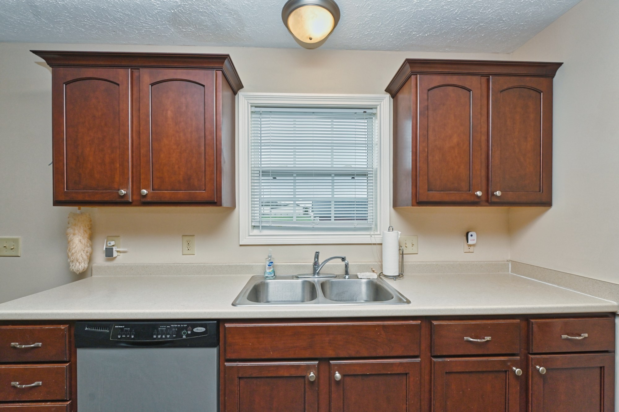 134 T G T Road Portland, TN 37148 - Photo 10 of 27 a sink with cabinets and window