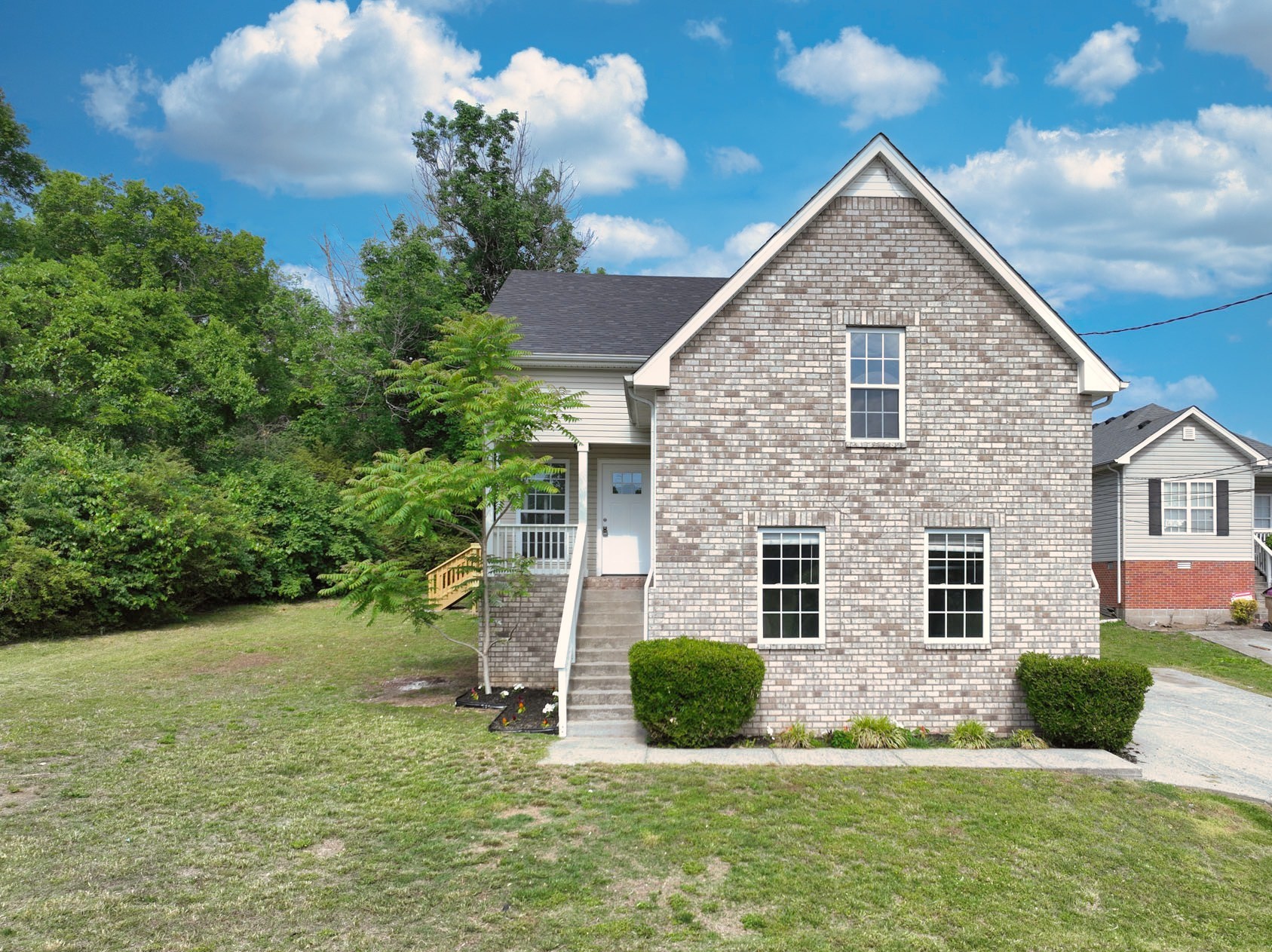 200 Larkin Springs Road Madison, TN 37115 - Photo 19 of 89 a front view of a house with a yard