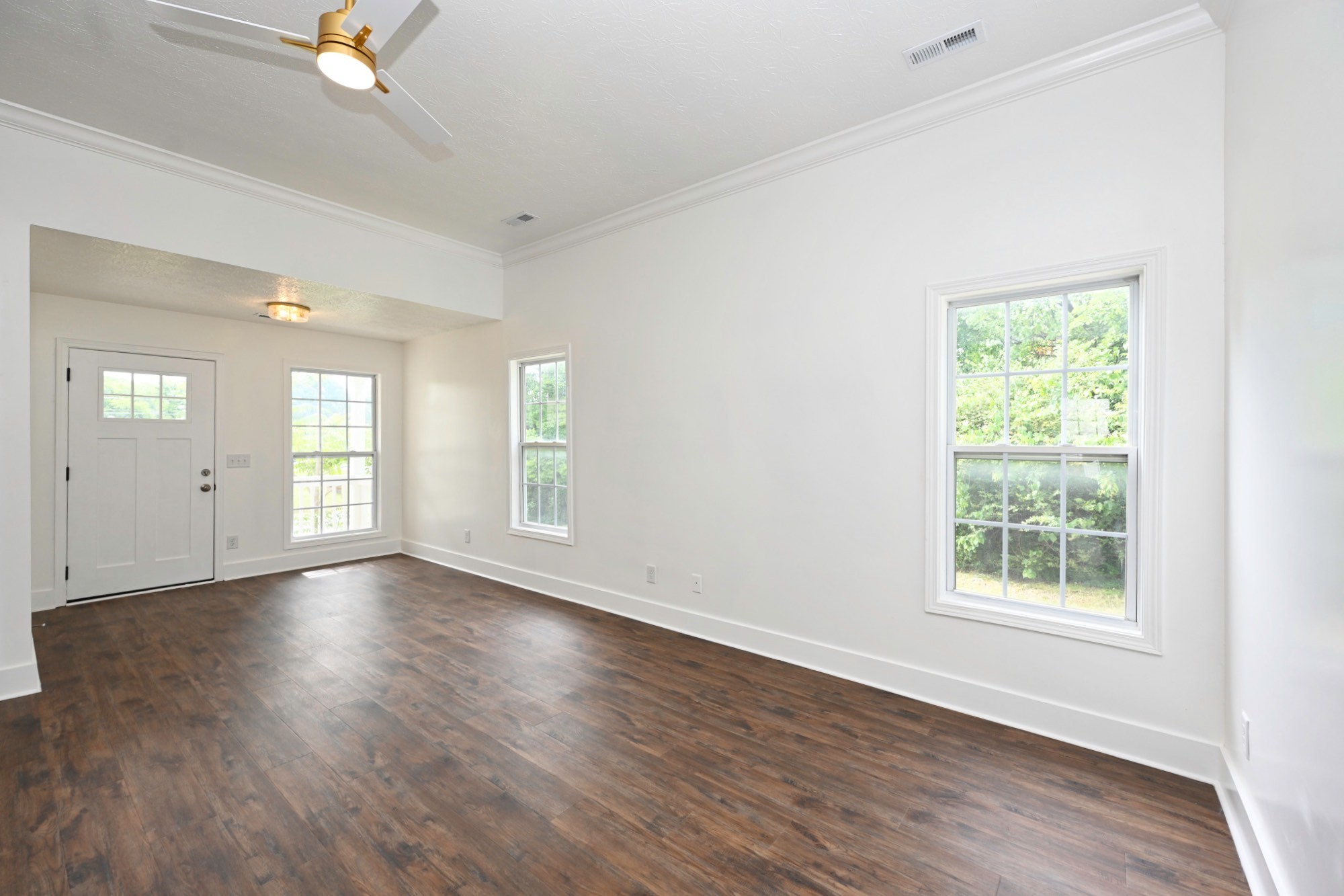 200 Larkin Springs Road Madison, TN 37115 - Photo 47 of 89 an empty room with wooden floor and windows