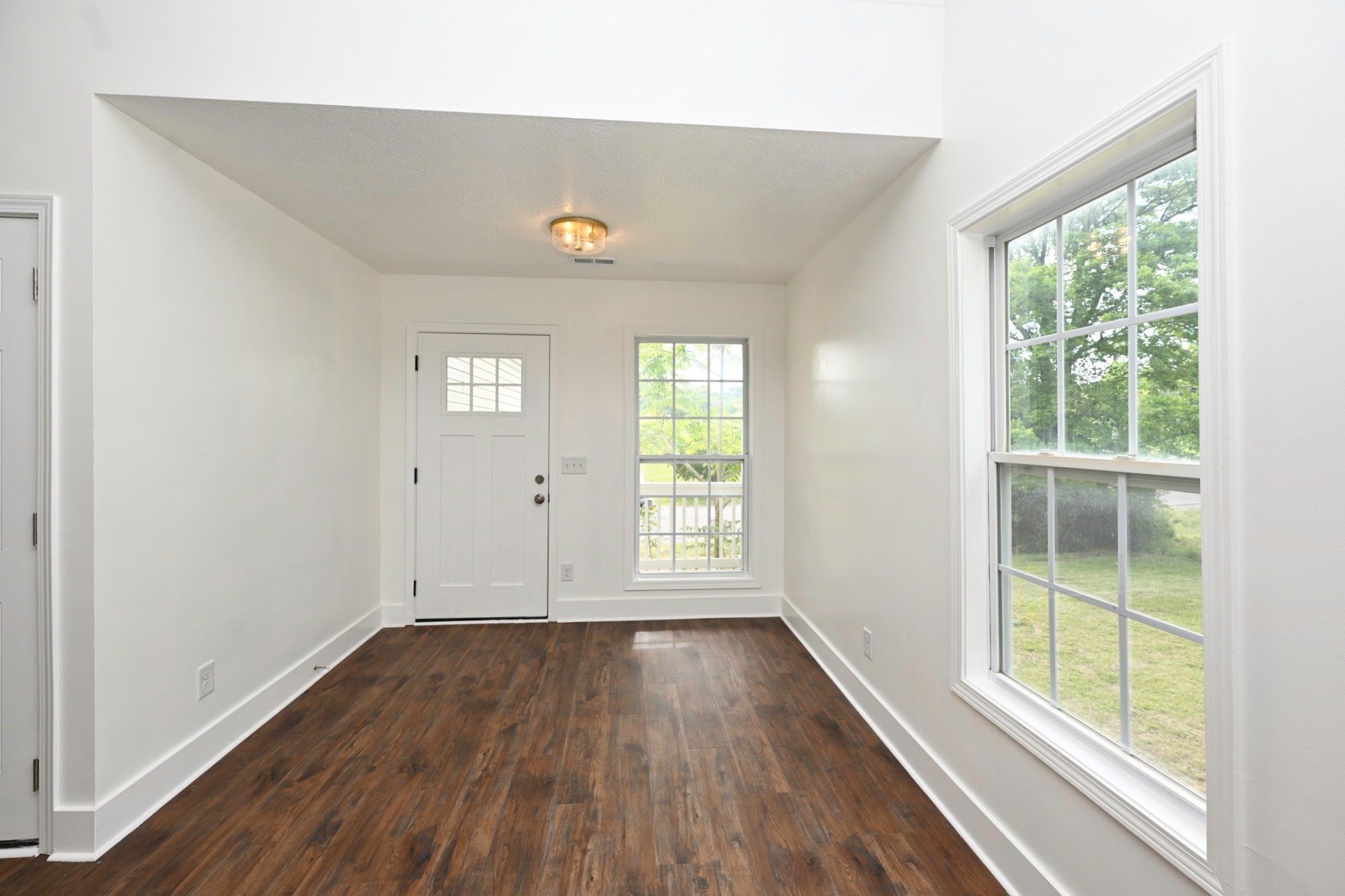 200 Larkin Springs Road Madison, TN 37115 - Photo 48 of 89 an empty room with wooden floor and windows