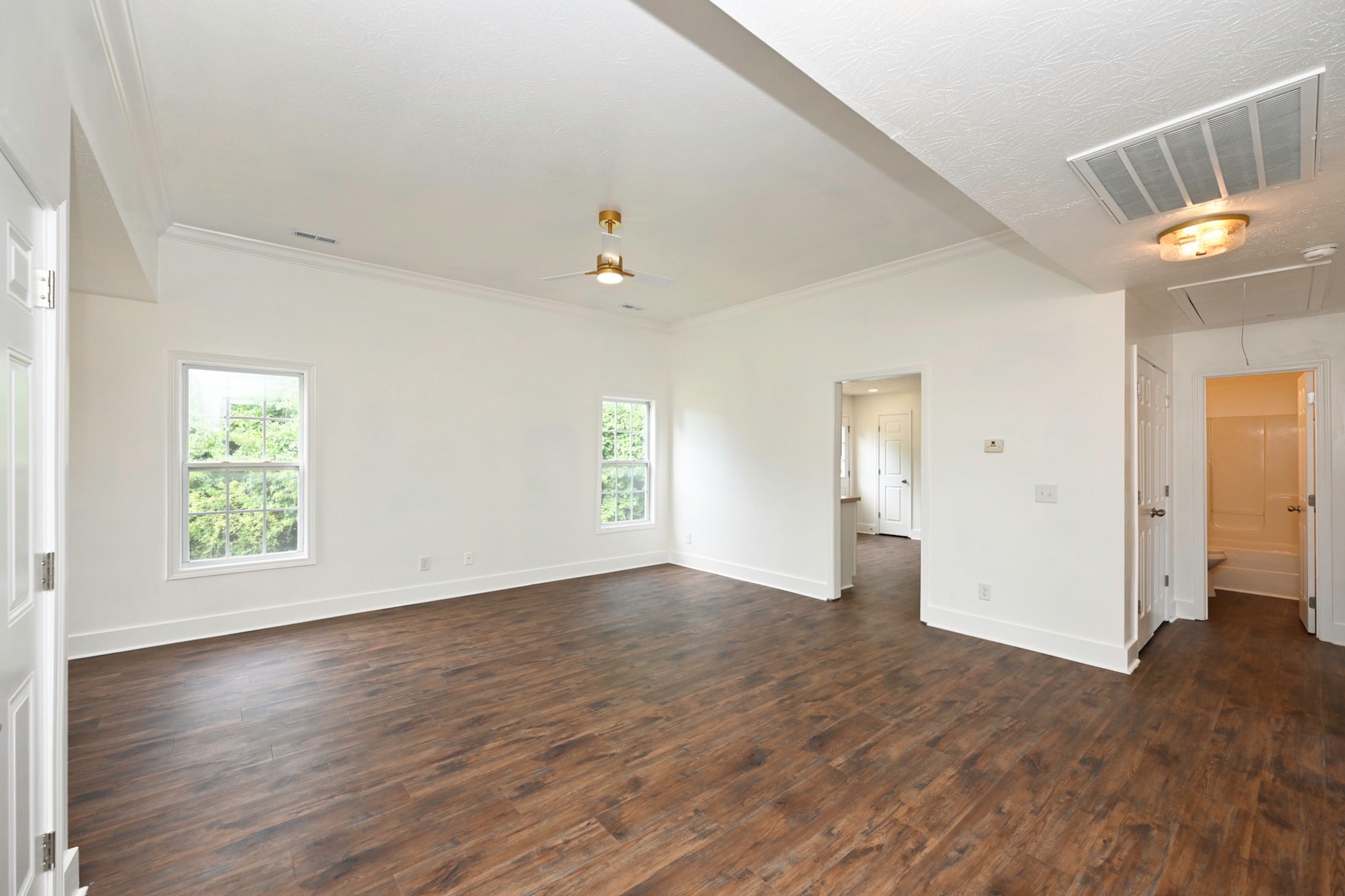 200 Larkin Springs Road Madison, TN 37115 - Photo 51 of 89 an empty room with wooden floor and windows