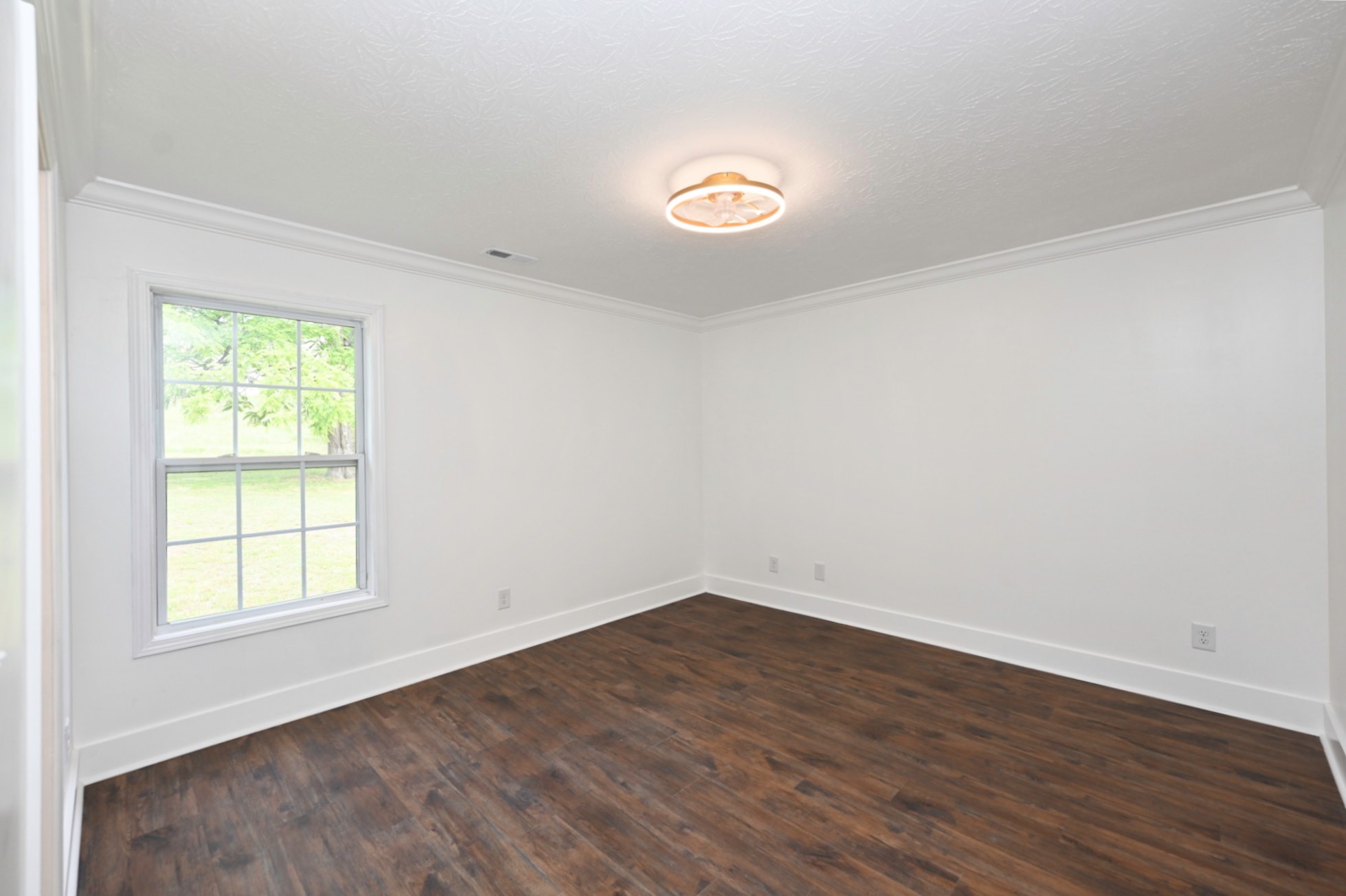 200 Larkin Springs Road Madison, TN 37115 - Photo 59 of 89 an empty room with wooden floor and windows