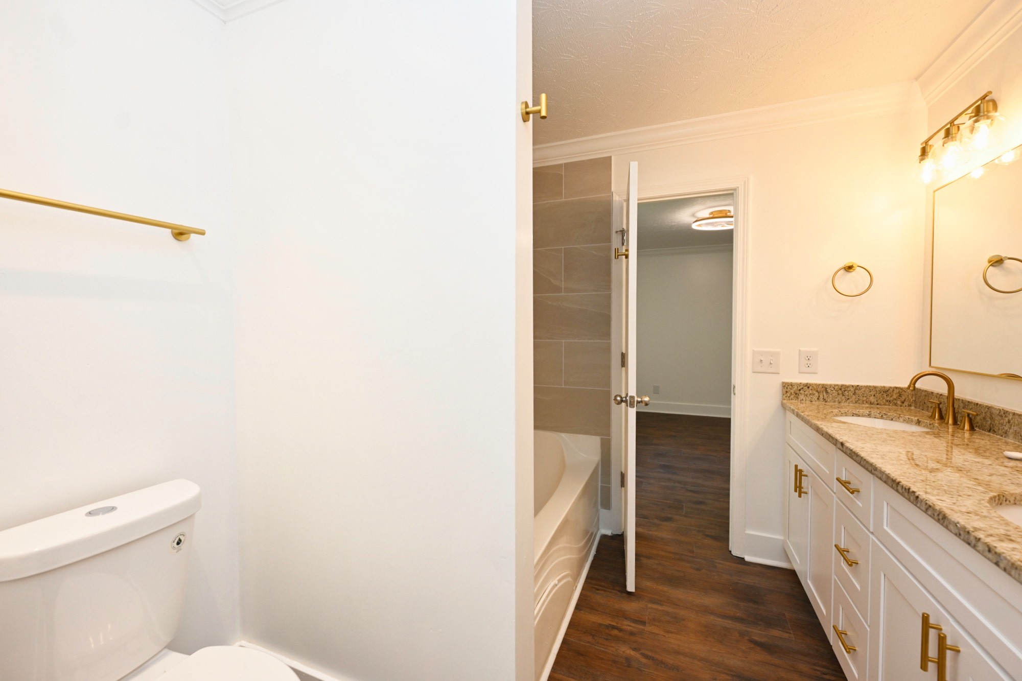 200 Larkin Springs Road Madison, TN 37115 - Photo 65 of 89 a bathroom with a granite countertop sink a toilet and shower